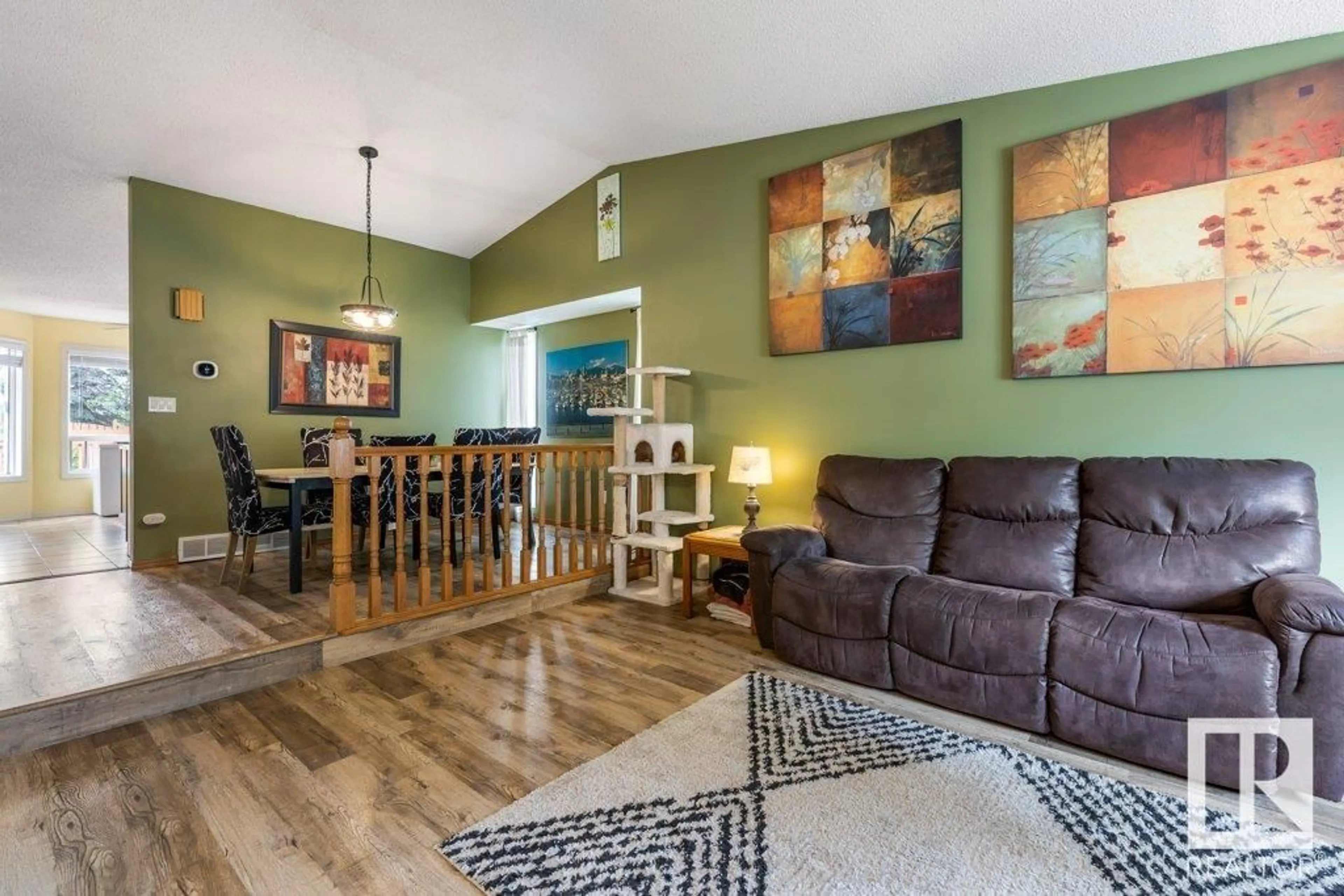 Living room with furniture, wood/laminate floor for 22 LEPINE PL, St. Albert Alberta T8N4M9