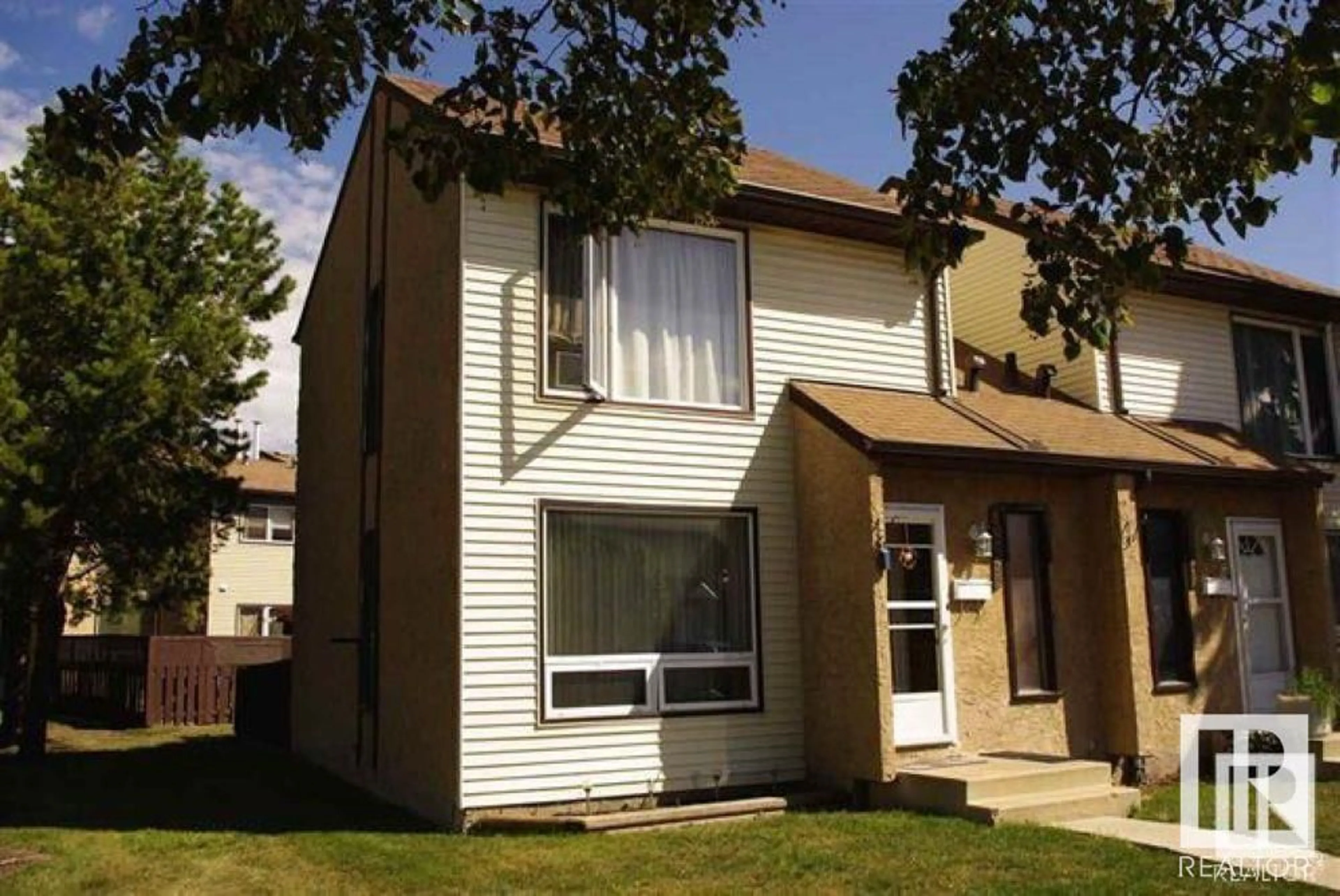 Home with vinyl exterior material, street for NW - 14747 25 ST, Edmonton Alberta T5E2E8