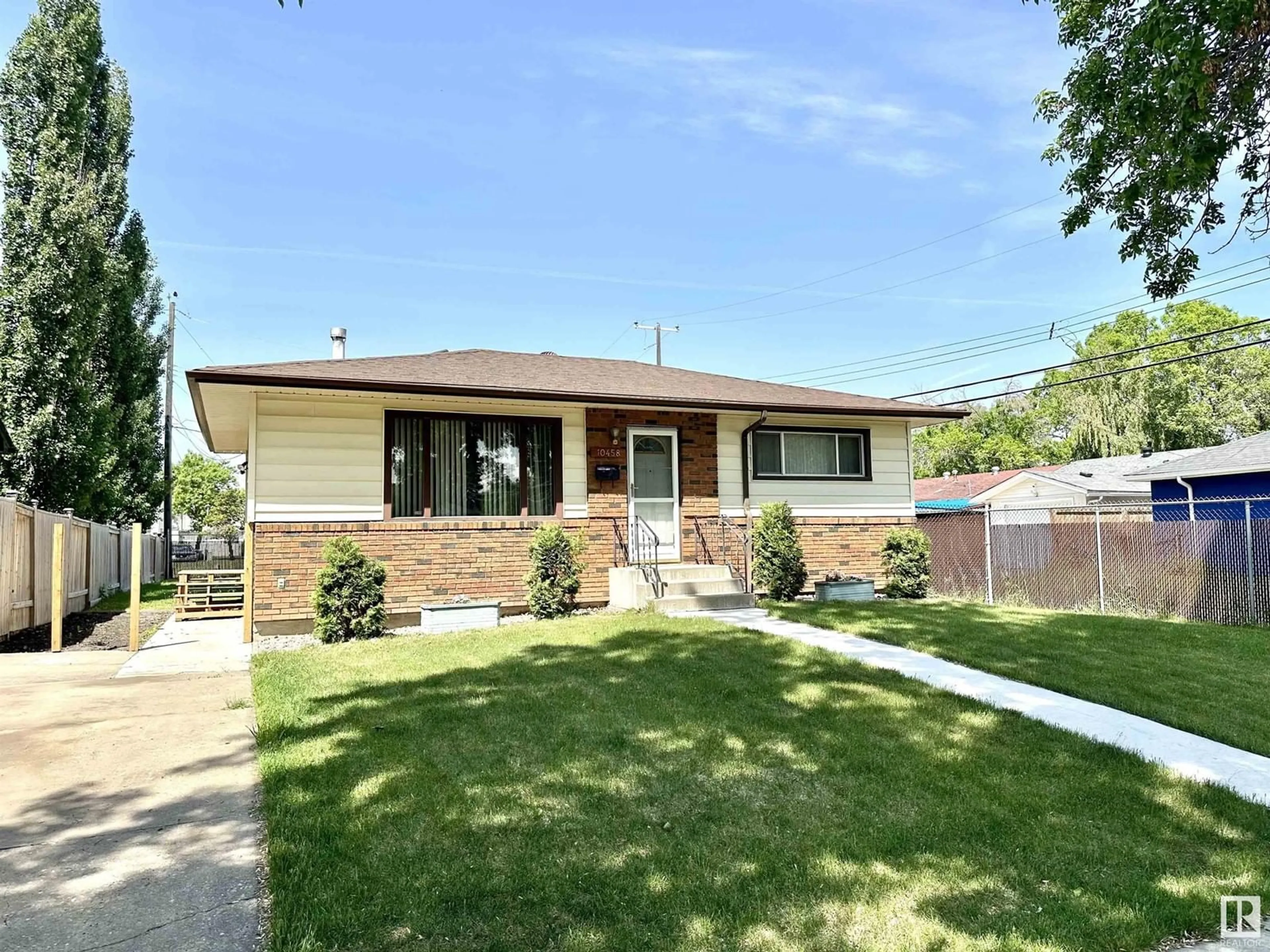 Home with brick exterior material, street for NW - 10458 166 ST, Edmonton Alberta T5P4C7