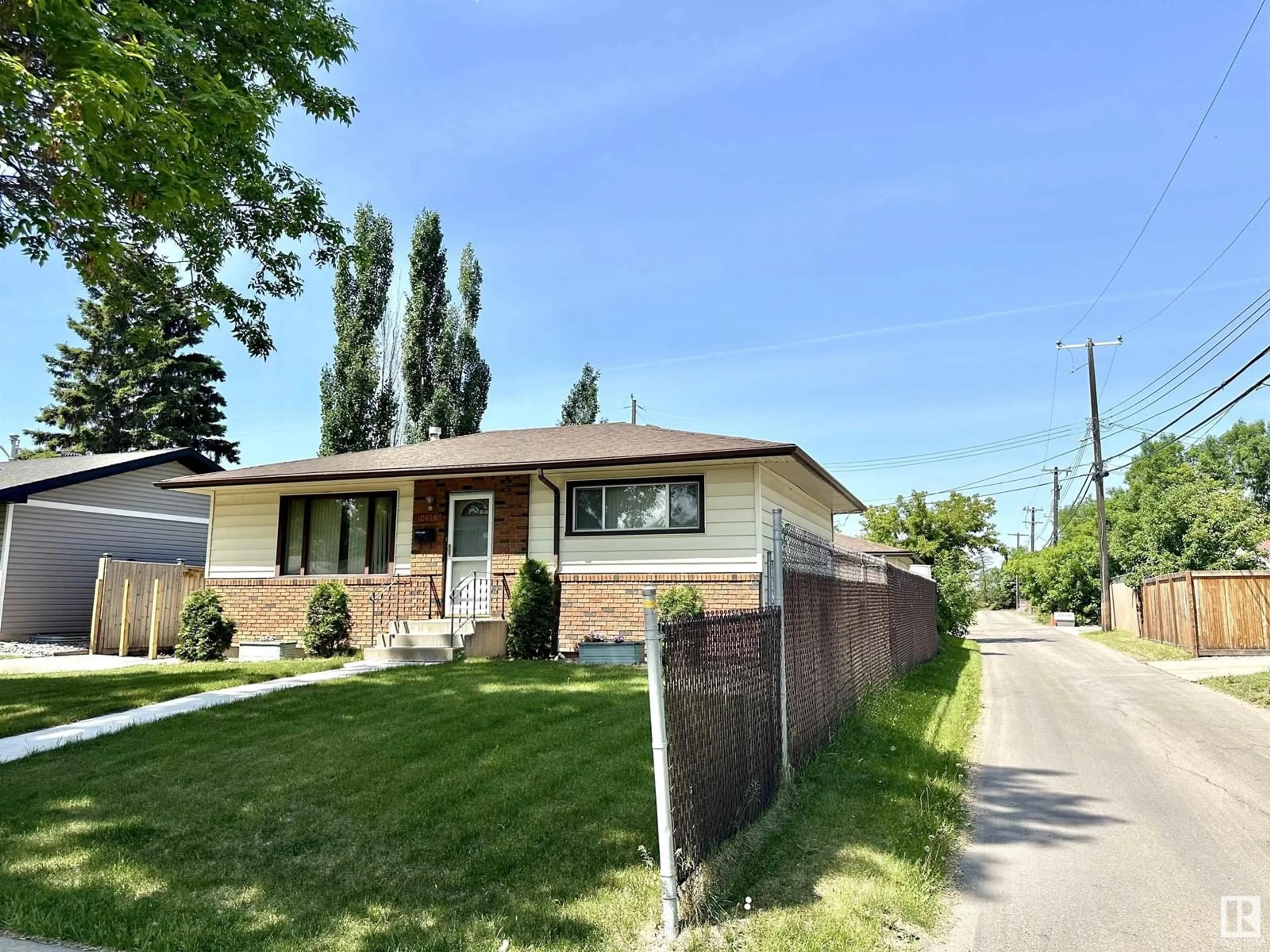 Home with brick exterior material, street for NW - 10458 166 ST, Edmonton Alberta T5P4C7