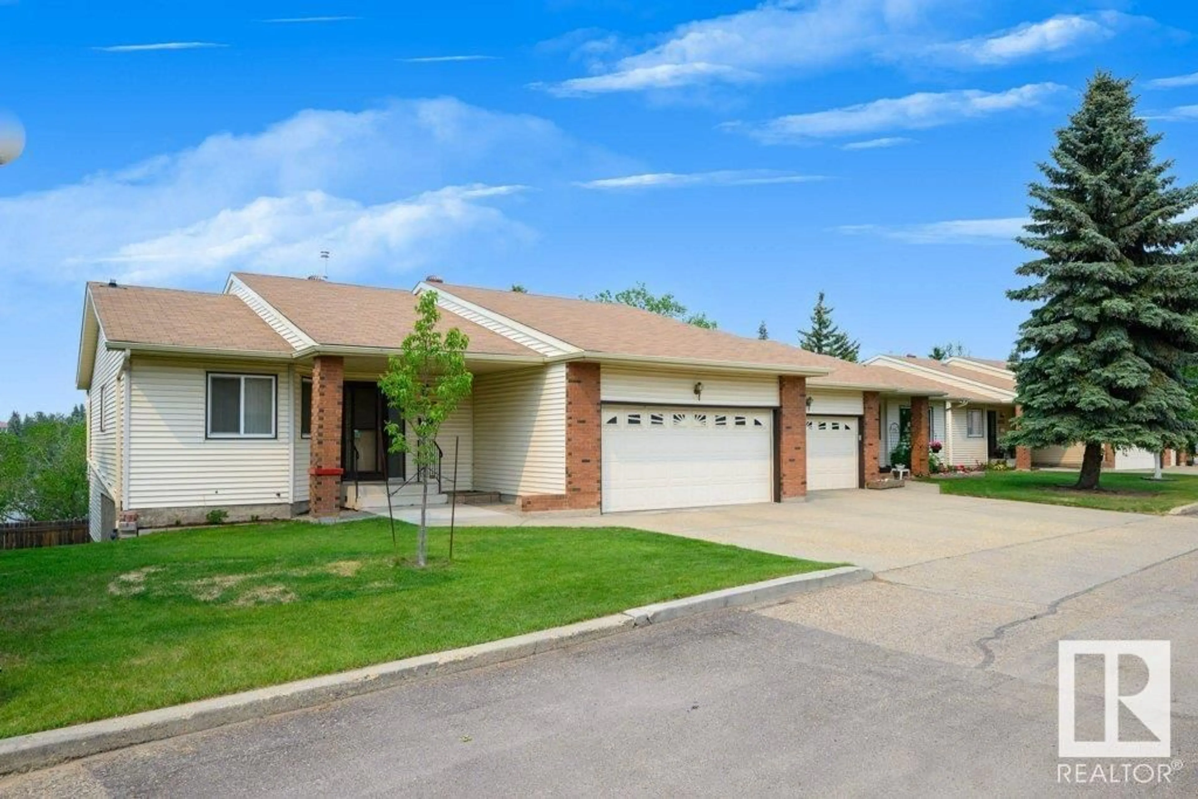 Home with brick exterior material, street for 10658 153 AV NW, Edmonton Alberta T5X5R8