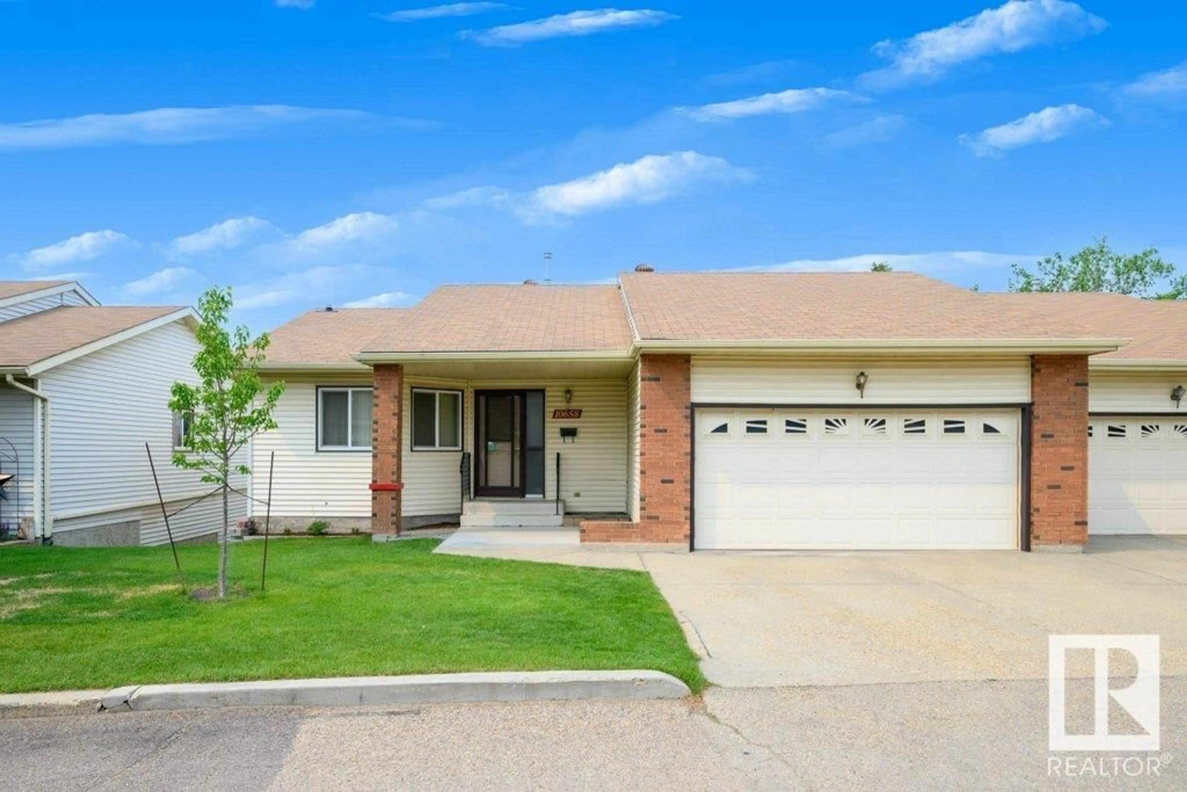 Home with brick exterior material, street for 10658 153 AV NW, Edmonton Alberta T5X5R8