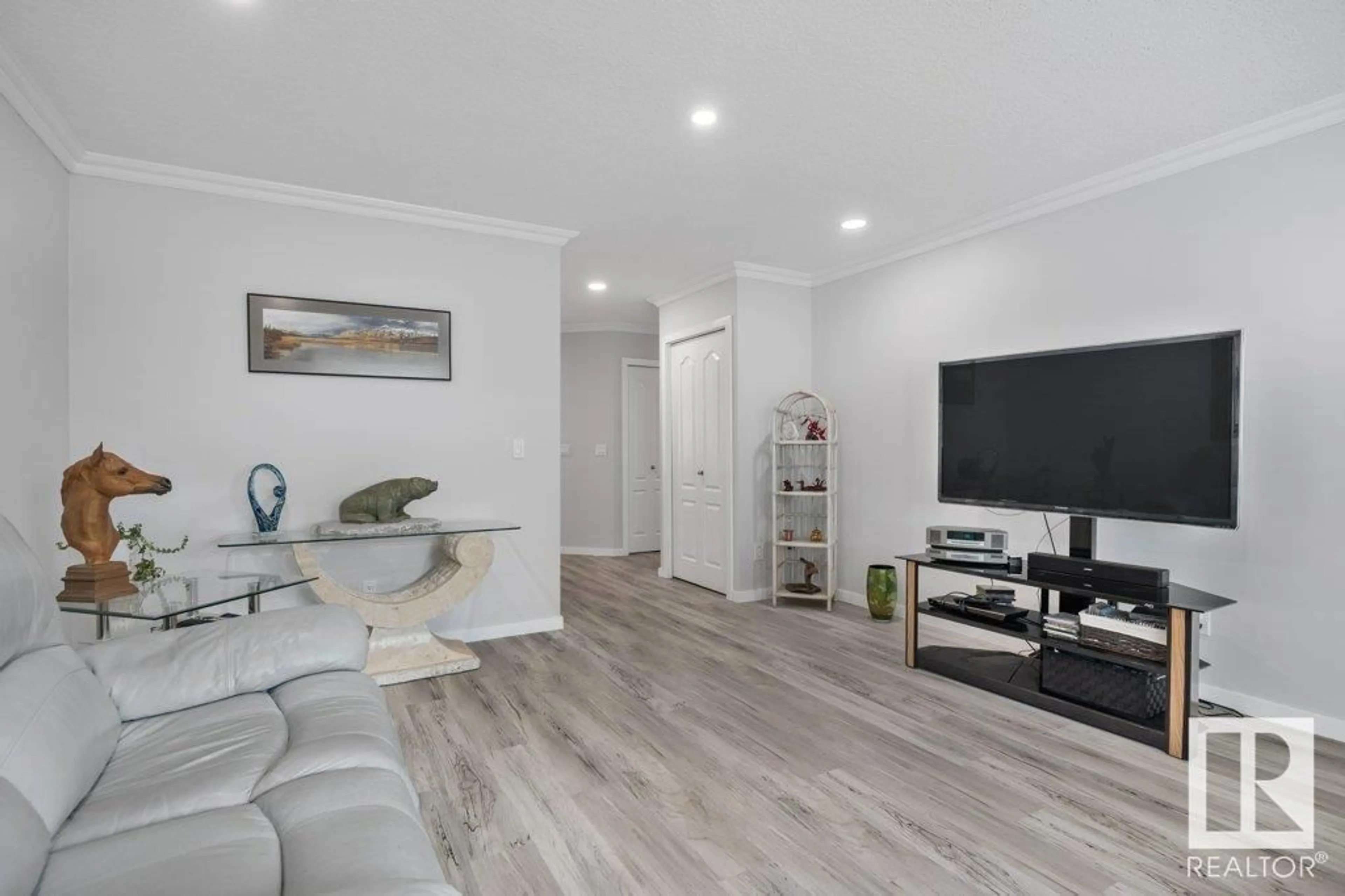 Living room with furniture, wood/laminate floor for 3 - 66 POIRIER AV, St. Albert Alberta T8N6M6