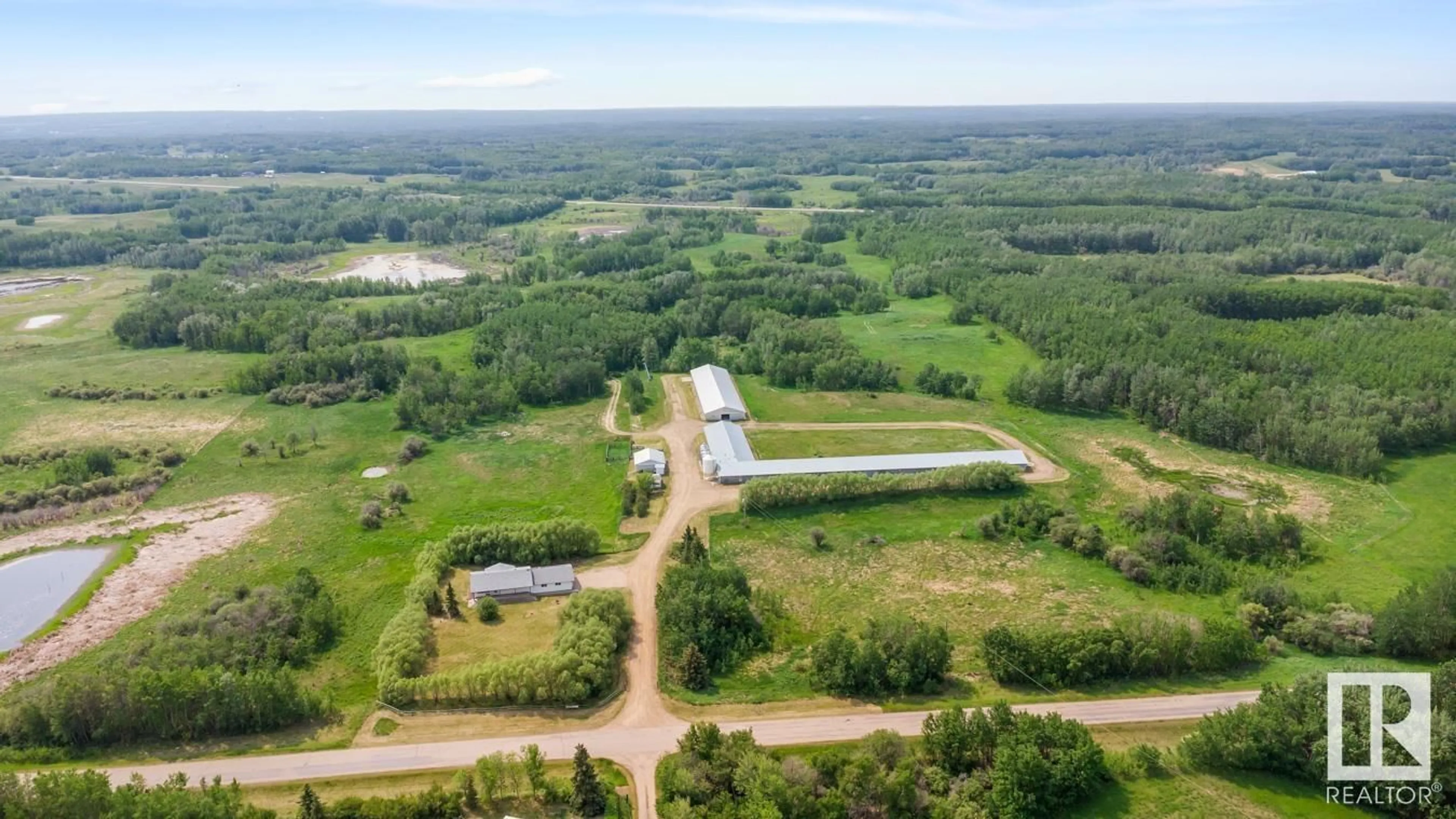 A pic from outside/outdoor area/front of a property/back of a property/a pic from drone, water/lake/river/ocean view for 20247 TWP ROAD 512, Rural Strathcona County Alberta T8G1E8