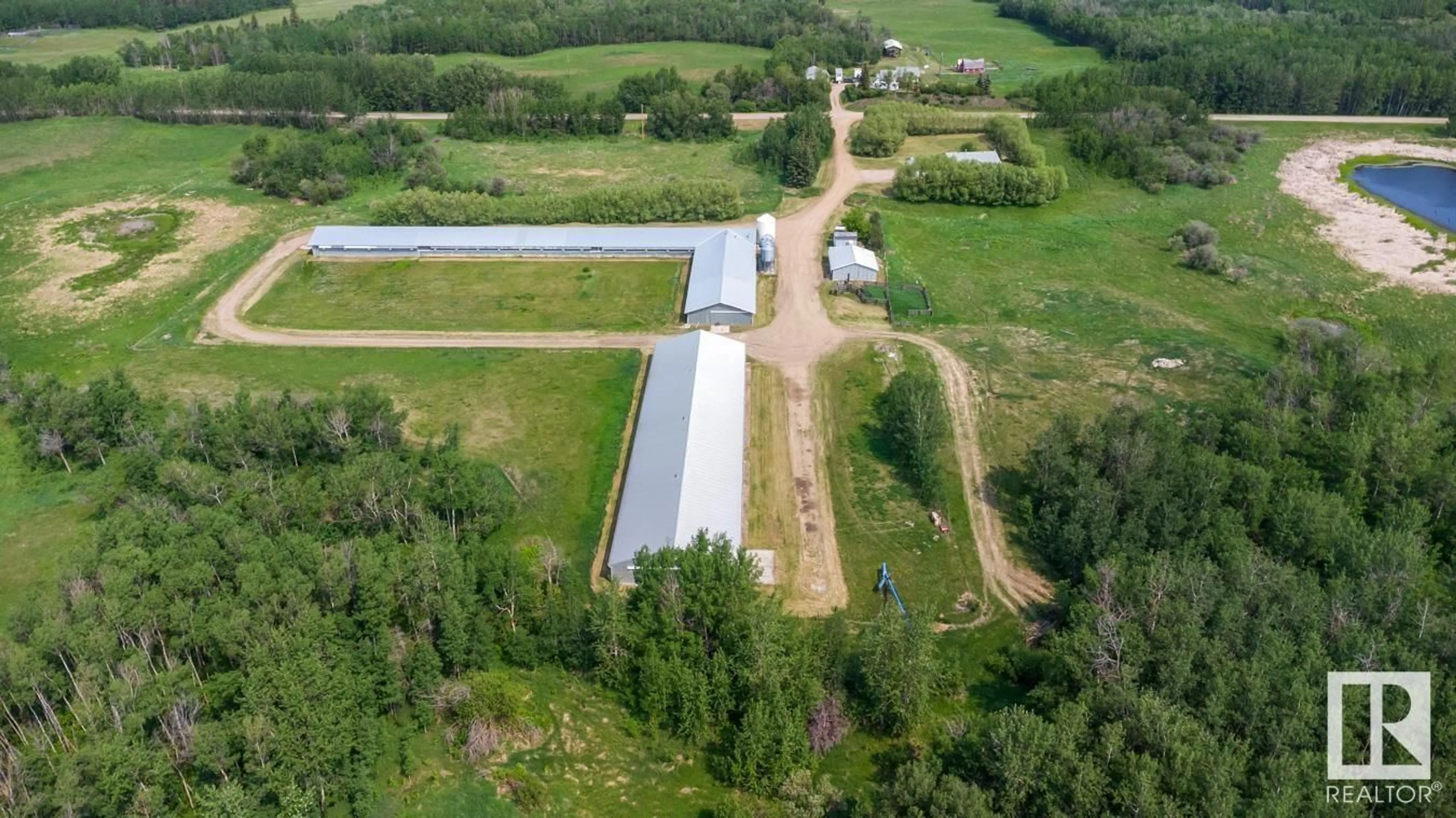 A pic from outside/outdoor area/front of a property/back of a property/a pic from drone, building for 20247 TWP ROAD 512, Rural Strathcona County Alberta T8G1E8