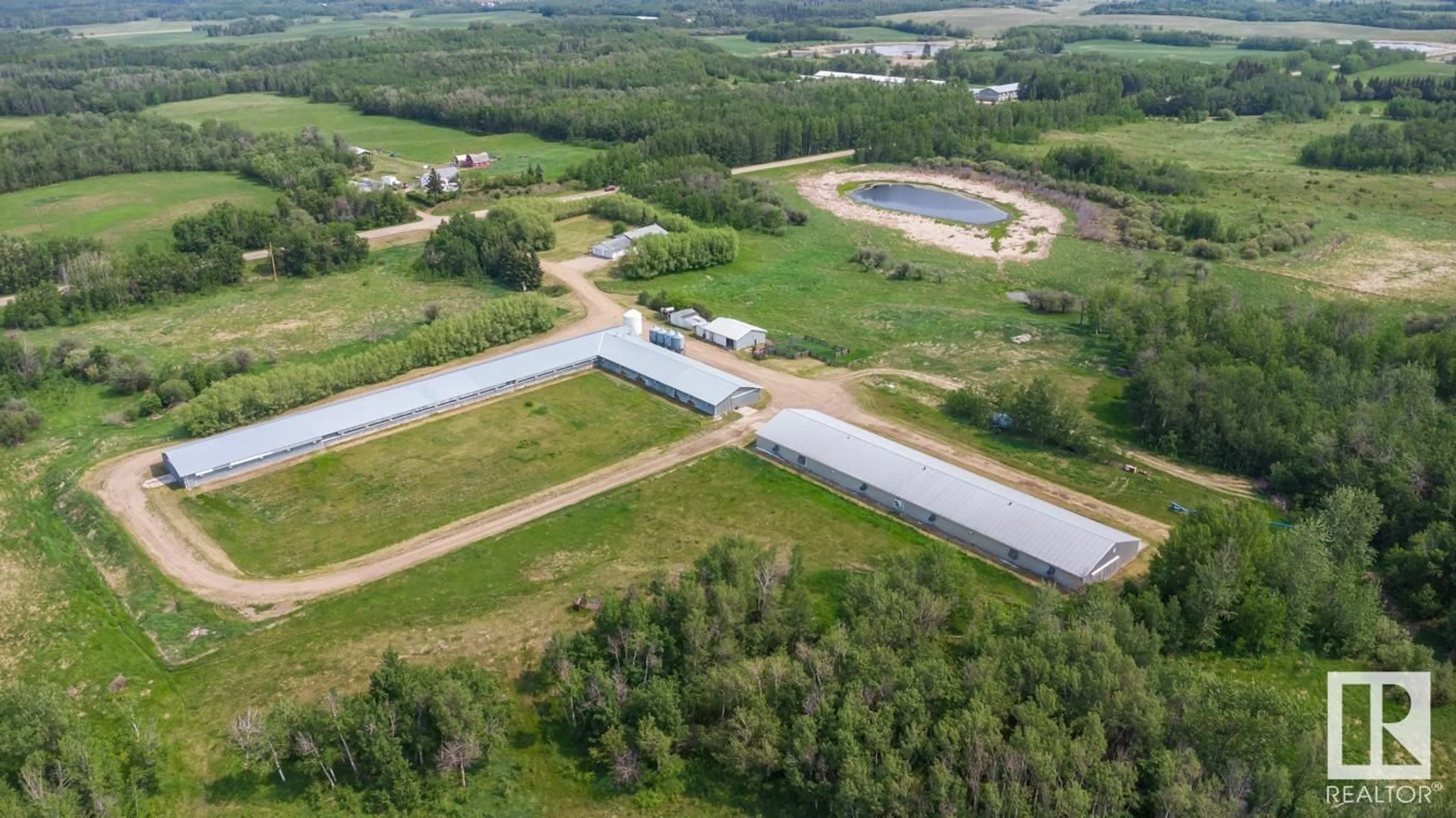 A pic from outside/outdoor area/front of a property/back of a property/a pic from drone, building for 20247 TWP ROAD 512, Rural Strathcona County Alberta T8G1E8