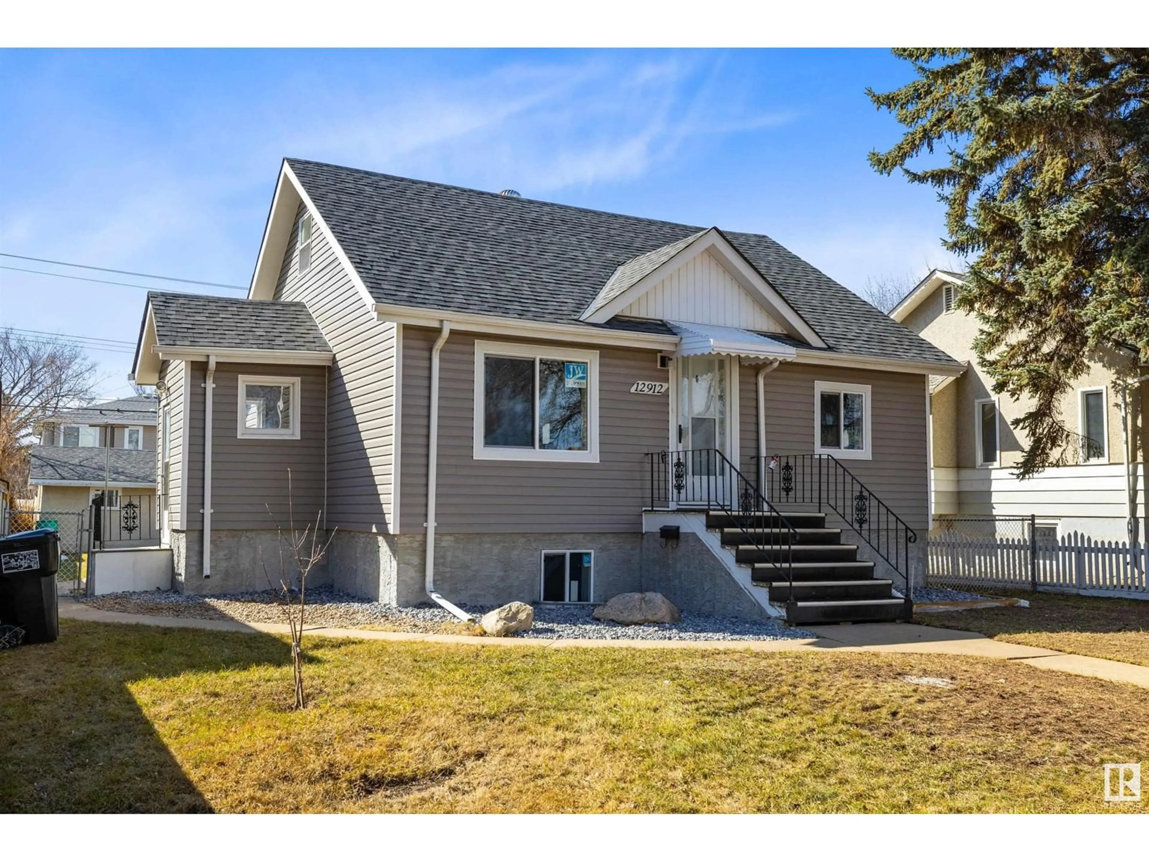 Home with vinyl exterior material, street for 12912 123A ST, Edmonton Alberta T5L0K9
