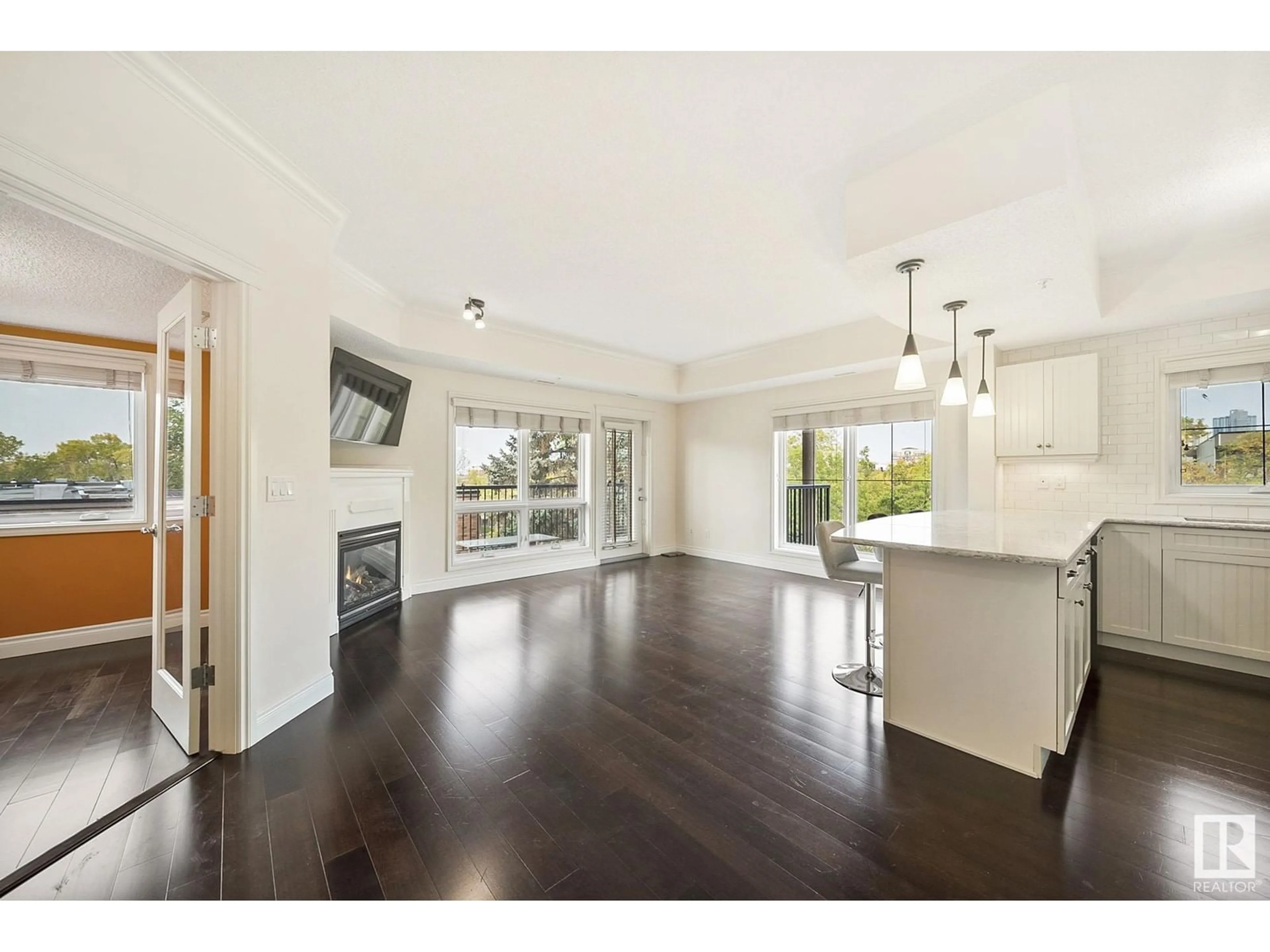 Open concept kitchen, wood/laminate floor for #401 - 10232 115 ST NW, Edmonton Alberta T5K1T8