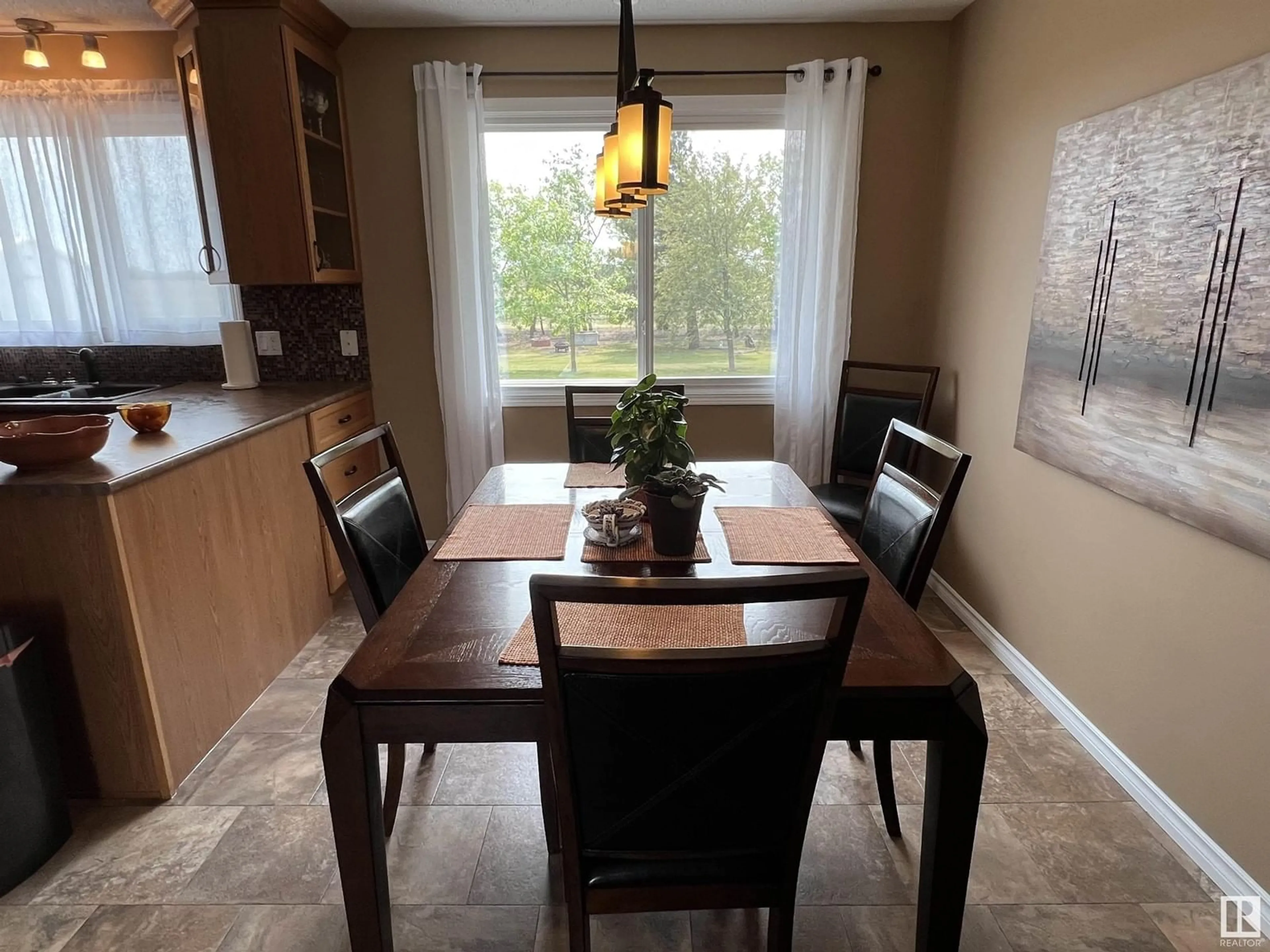 Dining room, wood/laminate floor for #1 - 26323 642 HI, Rural Sturgeon County Alberta T8R2A7