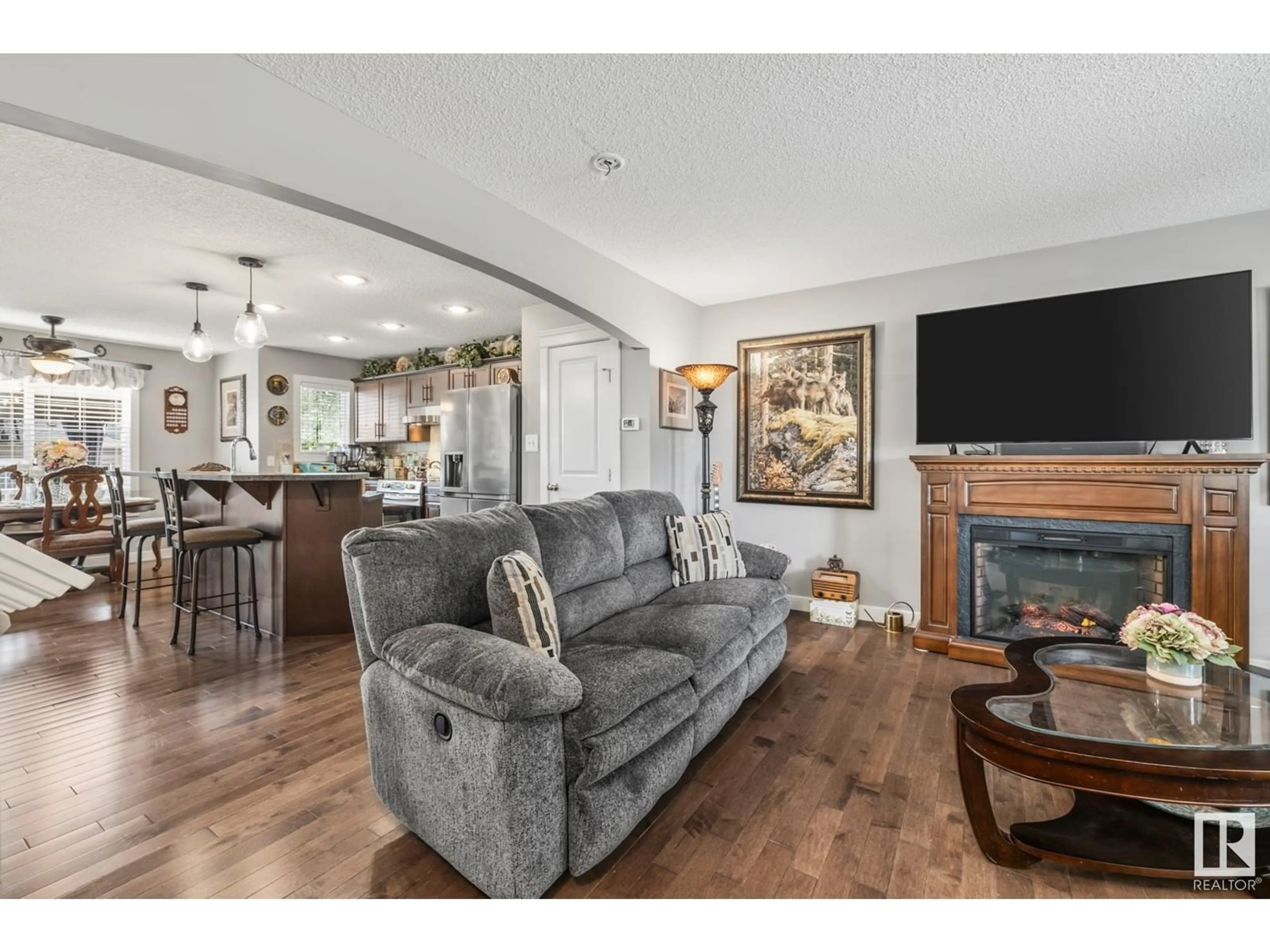 Living room with furniture, wood/laminate floor for 253 GRIESBACH RD, Edmonton Alberta T5E6S5