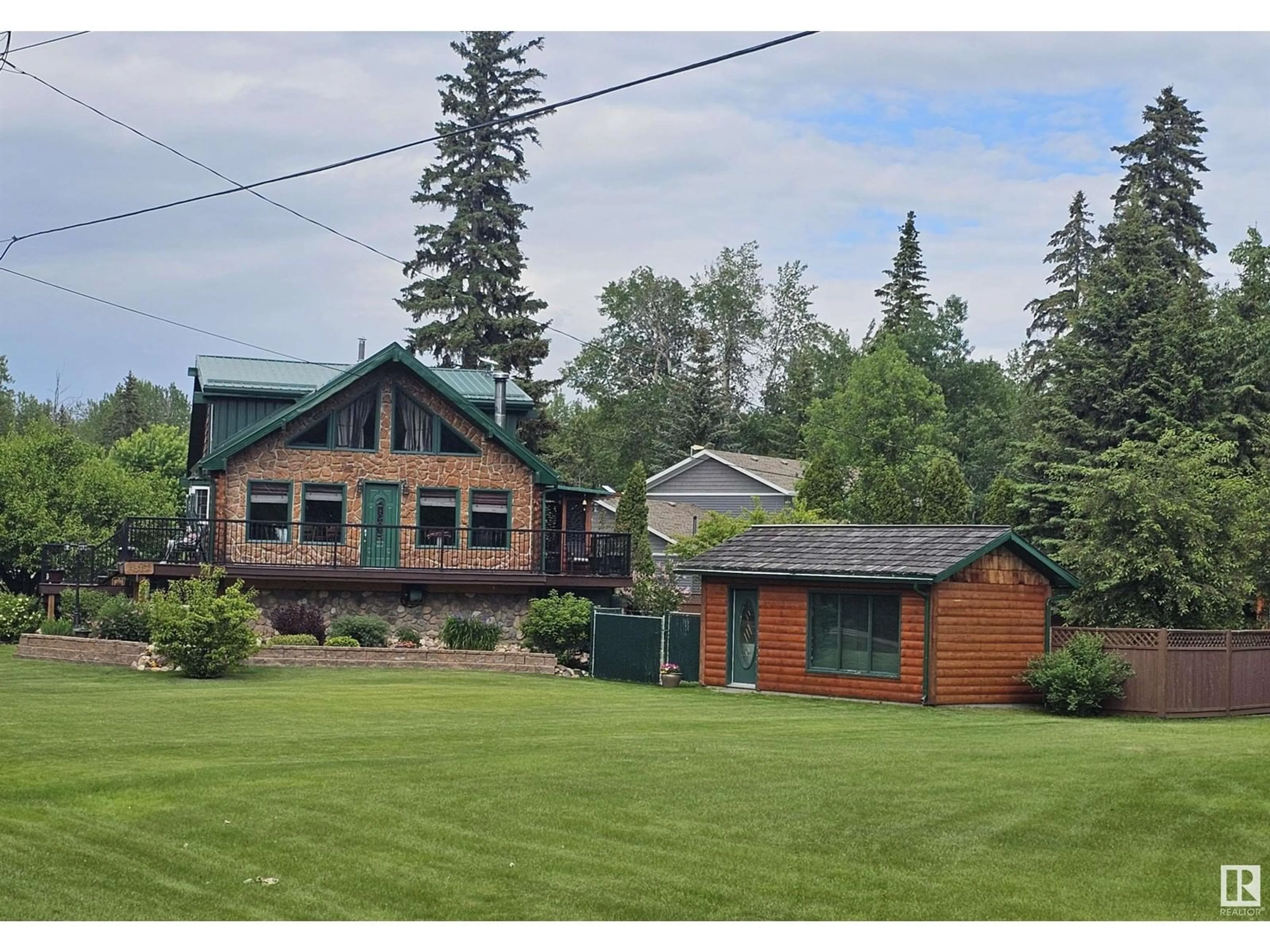 A pic from outside/outdoor area/front of a property/back of a property/a pic from drone, mountain view for 4815 49A AV, Rural Lac Ste. Anne County Alberta T0E0A0