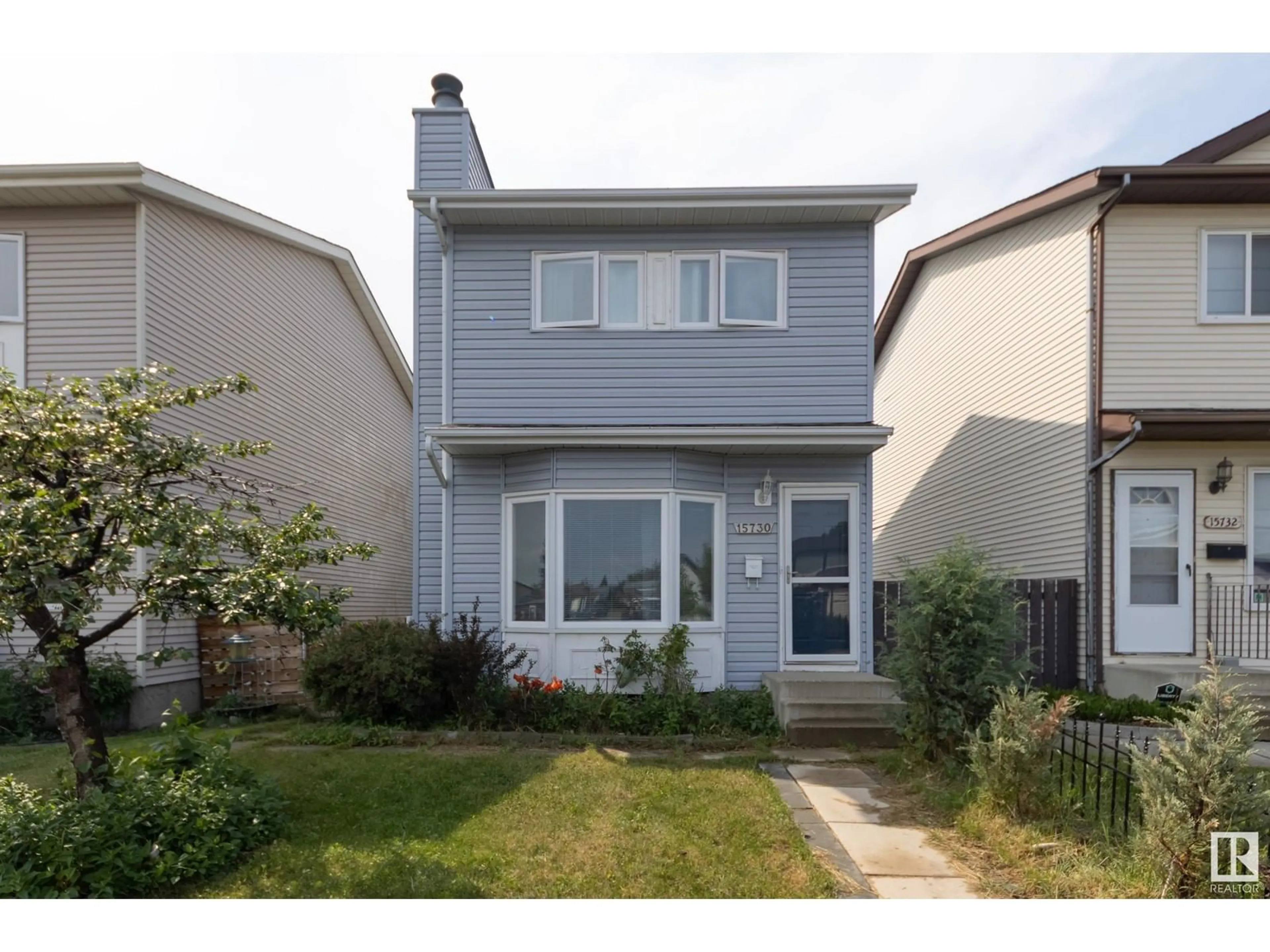 Home with vinyl exterior material, street for 15730 84 ST, Edmonton Alberta T5Z2P1