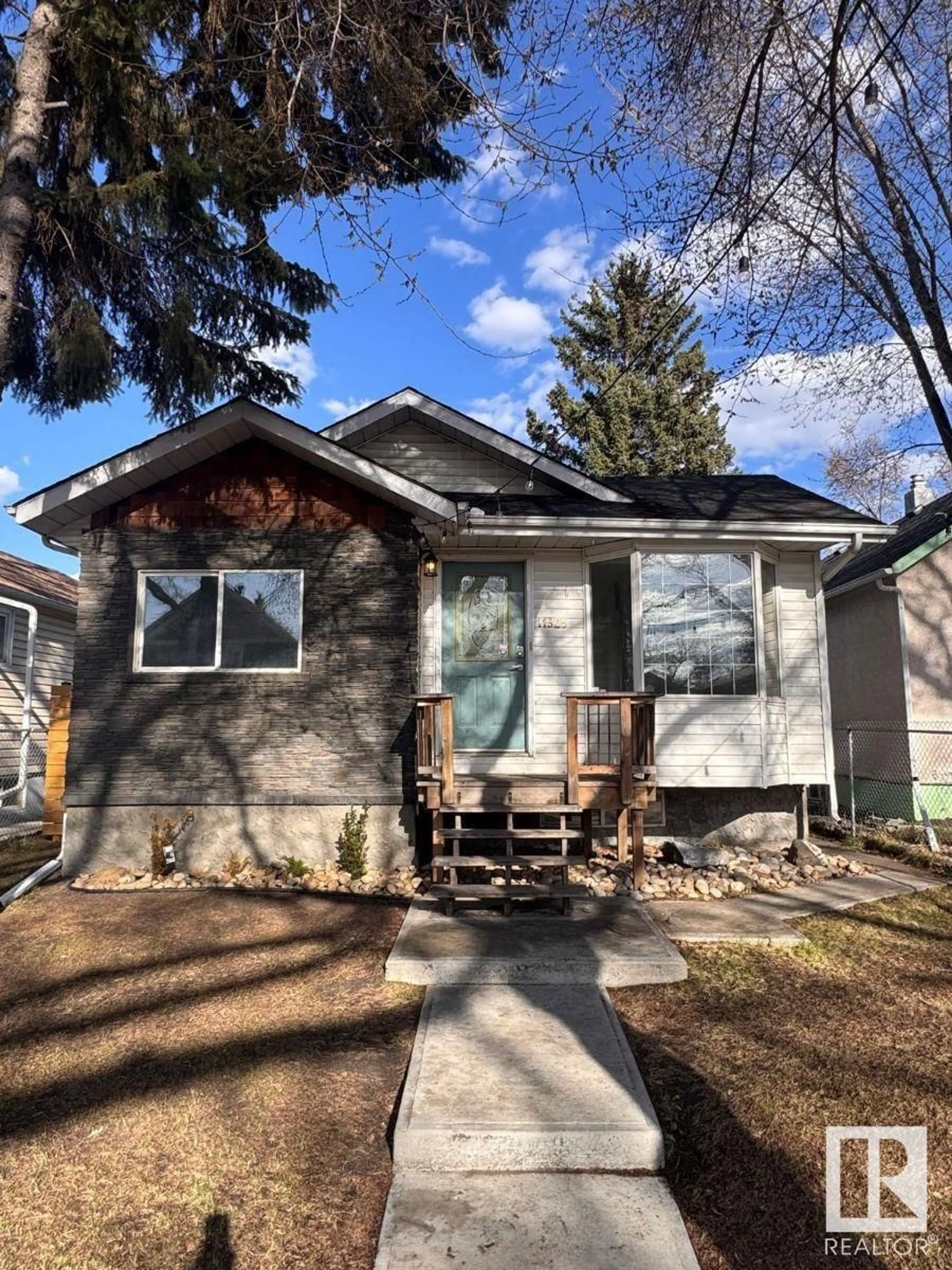 Home with vinyl exterior material, street for 11525 96 ST, Edmonton Alberta T6C3Y4