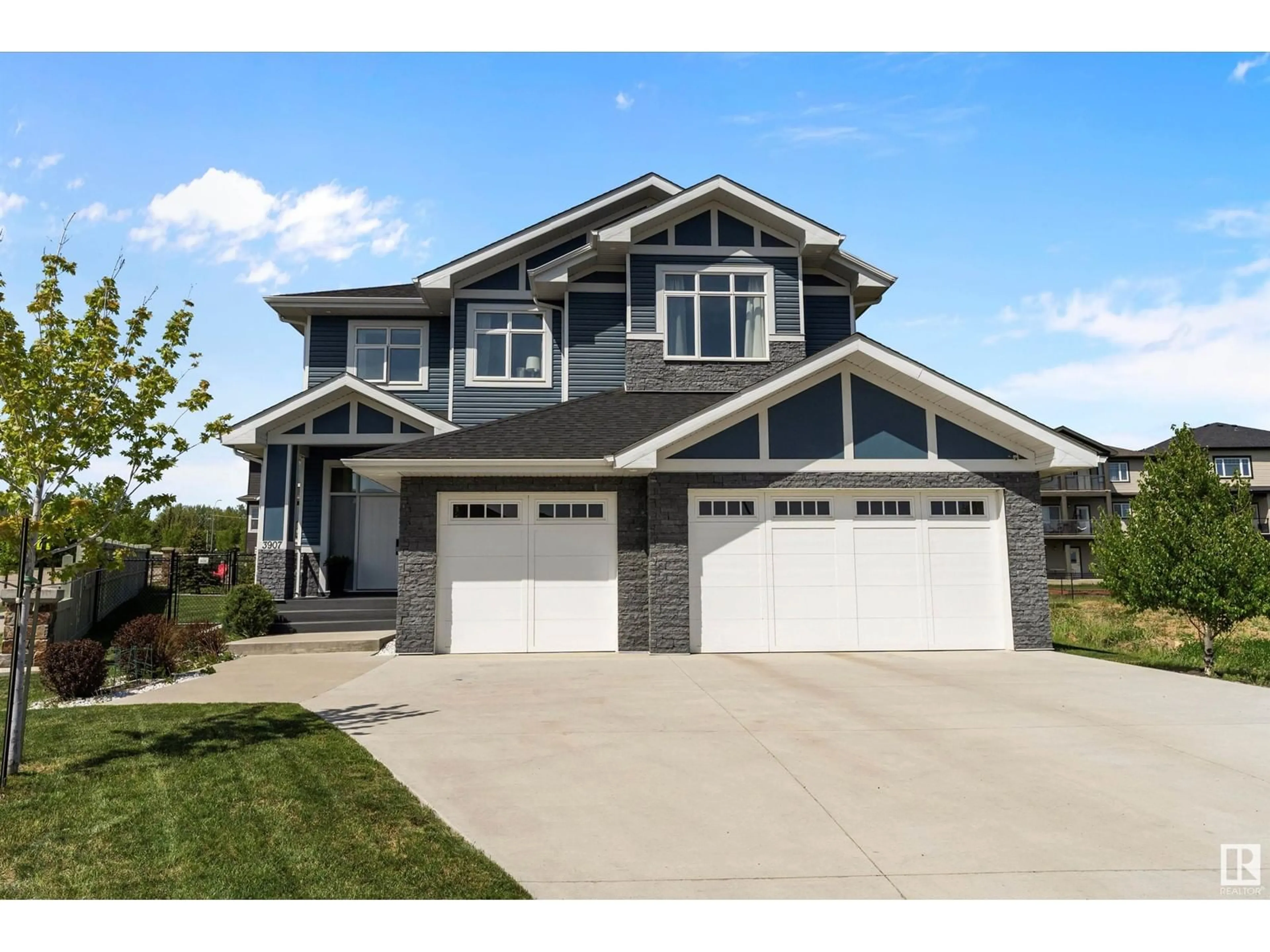Home with vinyl exterior material, street for 3907 47 AV, Beaumont Alberta T4X1X7