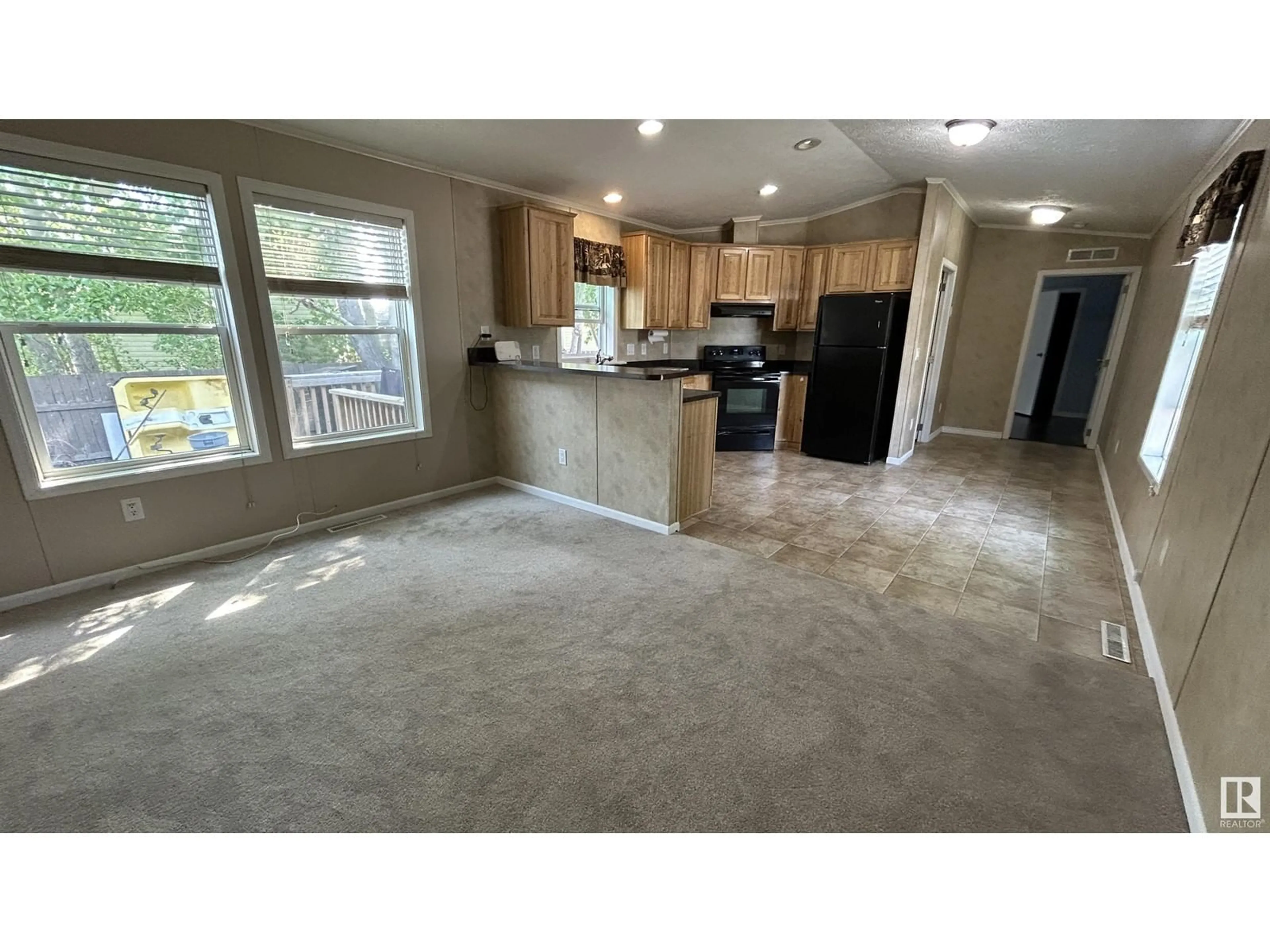 Open concept kitchen, ceramic/tile floor for 50 - 5508 55 ST, Bonnyville Town Alberta T9N2C6