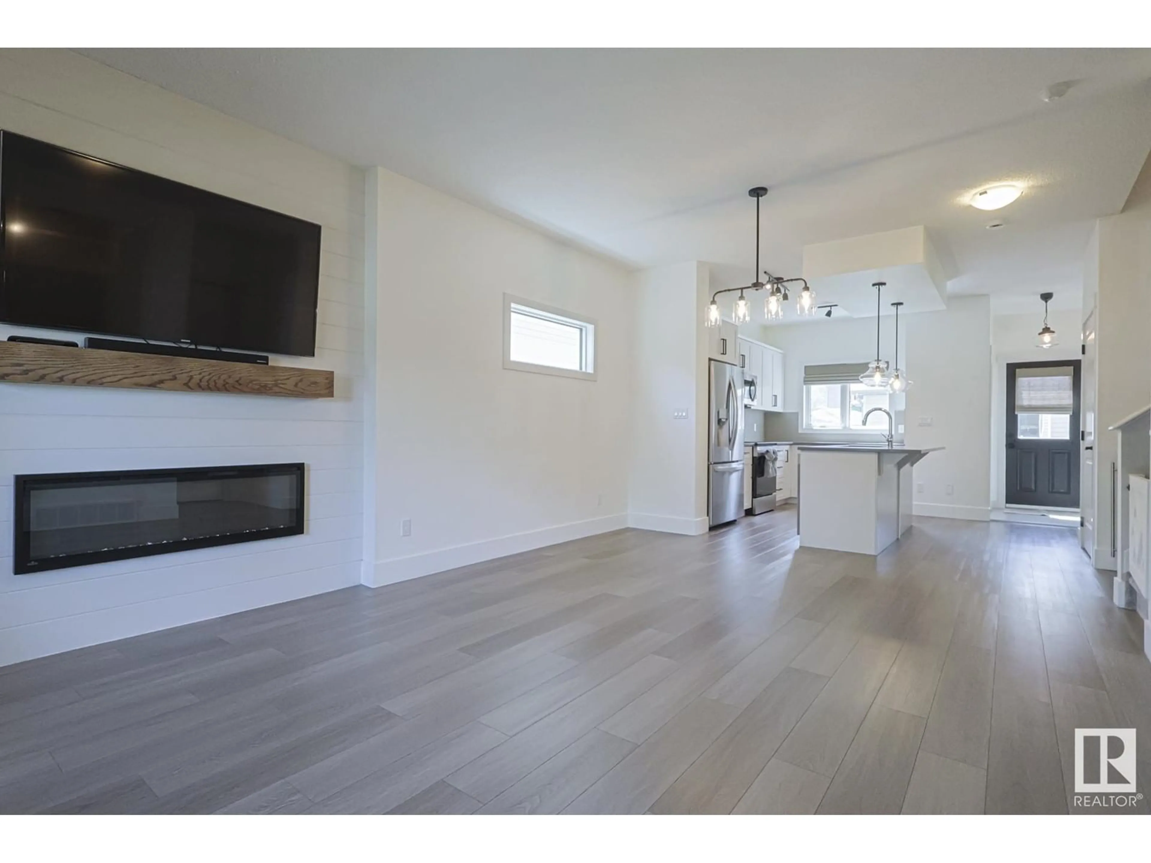 Open concept kitchen, wood/laminate floor for 189 HAWKS RIDGE BV, Edmonton Alberta T5S0H6