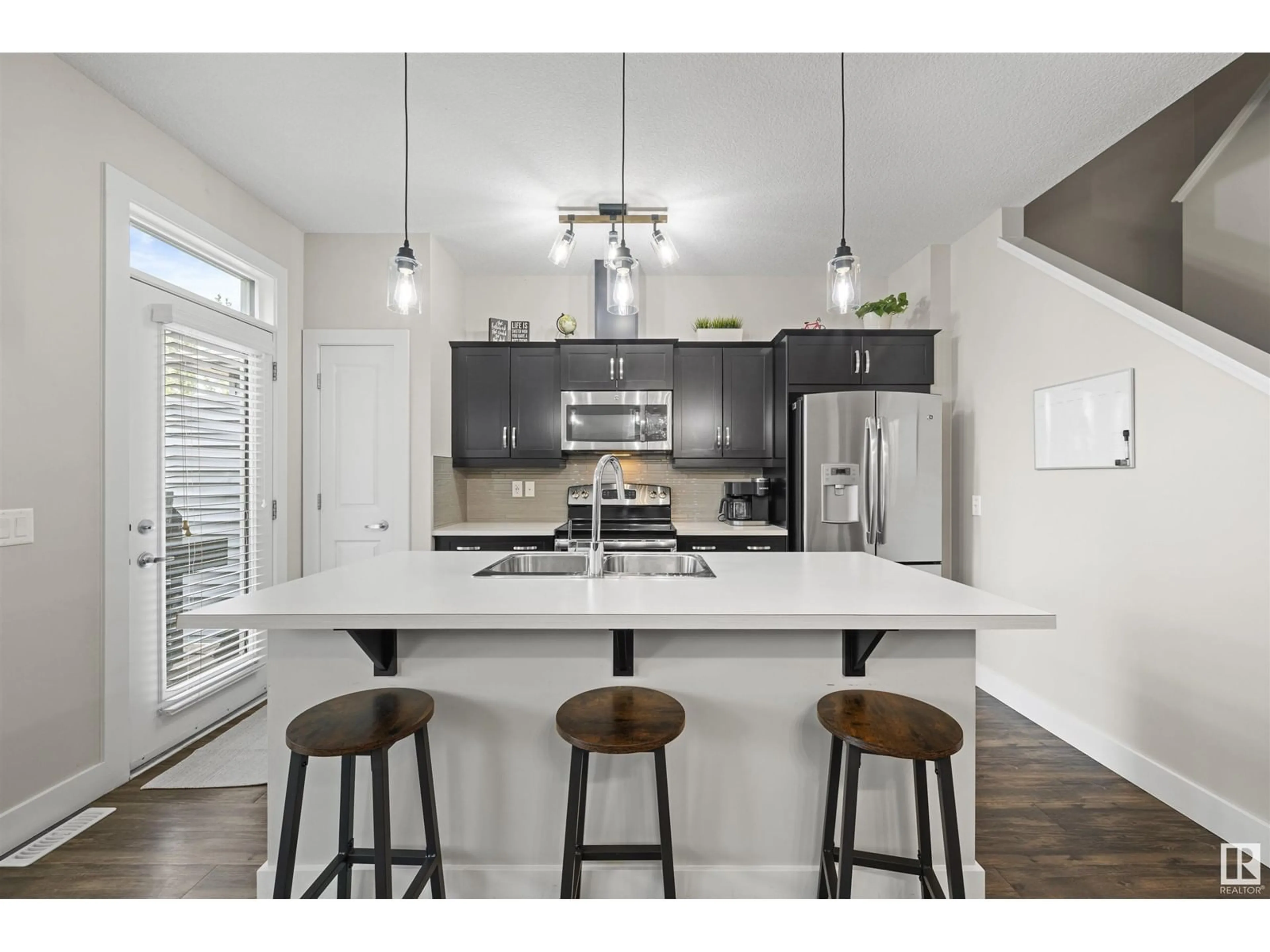 Open concept kitchen, wood/laminate floor for 125 AMBERLEY WY, Sherwood Park Alberta T8H0X2