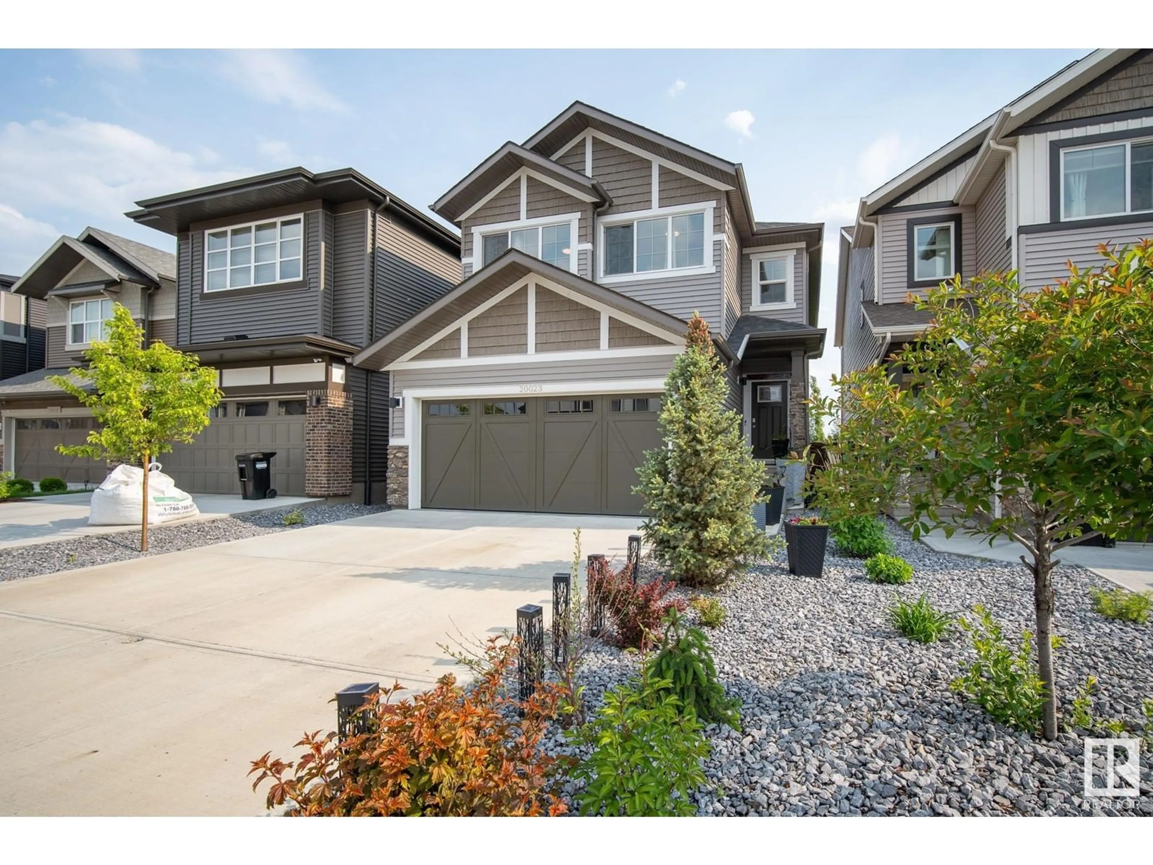 Home with vinyl exterior material, street for NW - 20023 26 AV, Edmonton Alberta T6M1K3