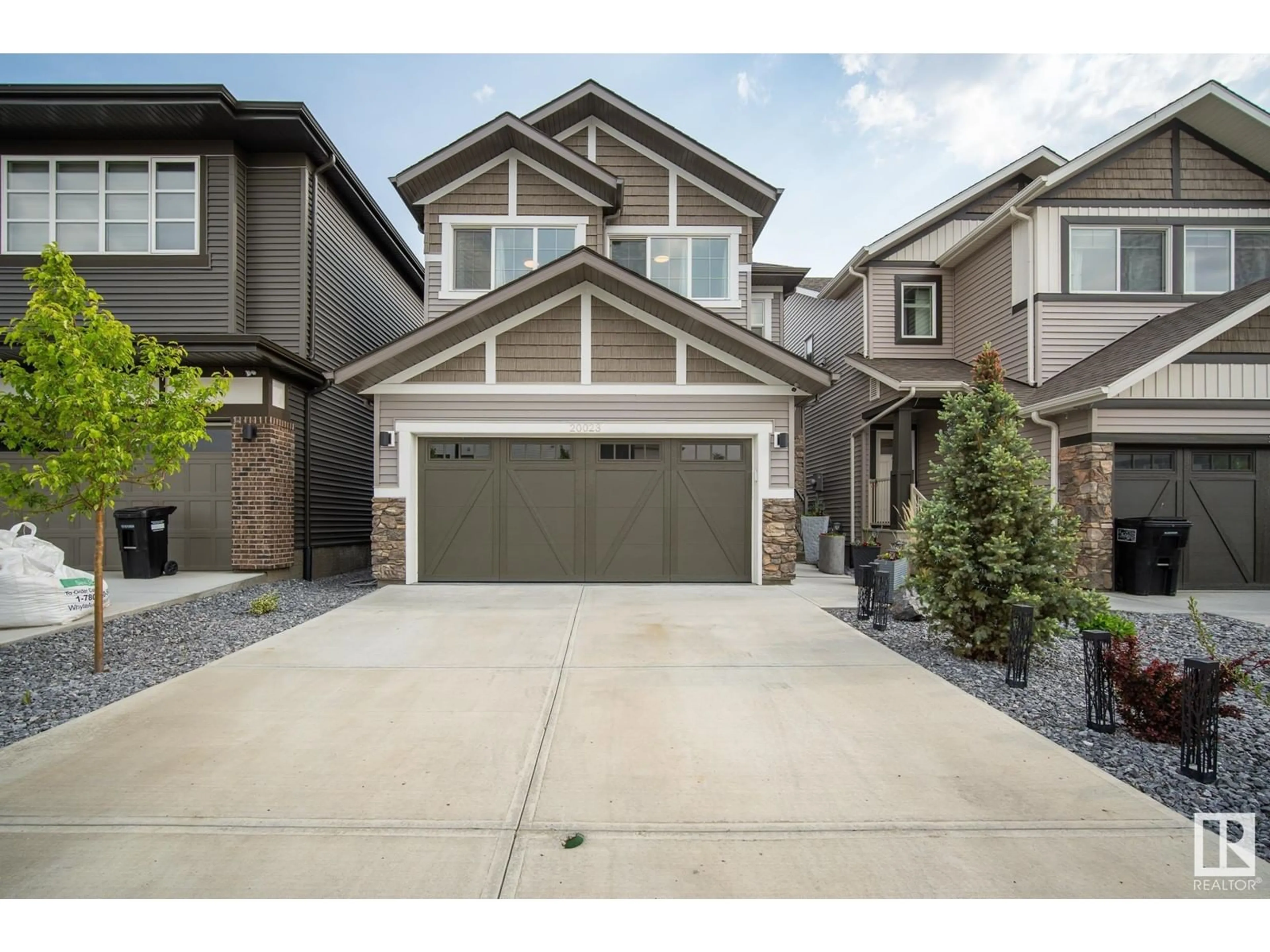 Home with vinyl exterior material, street for NW - 20023 26 AV, Edmonton Alberta T6M1K3