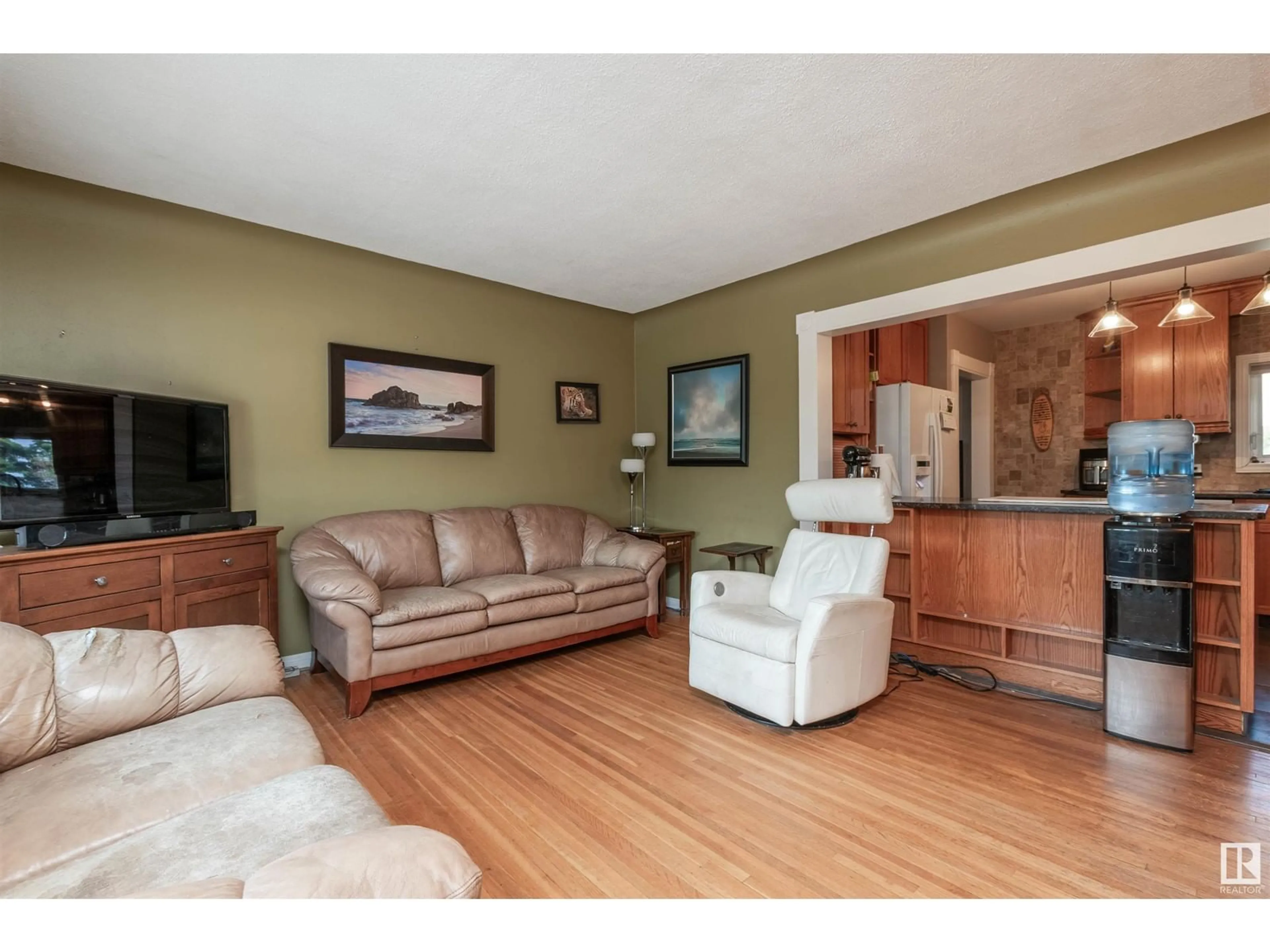Living room with furniture, wood/laminate floor for 53550 RGE ROAD 220, Rural Strathcona County Alberta T8E2B6