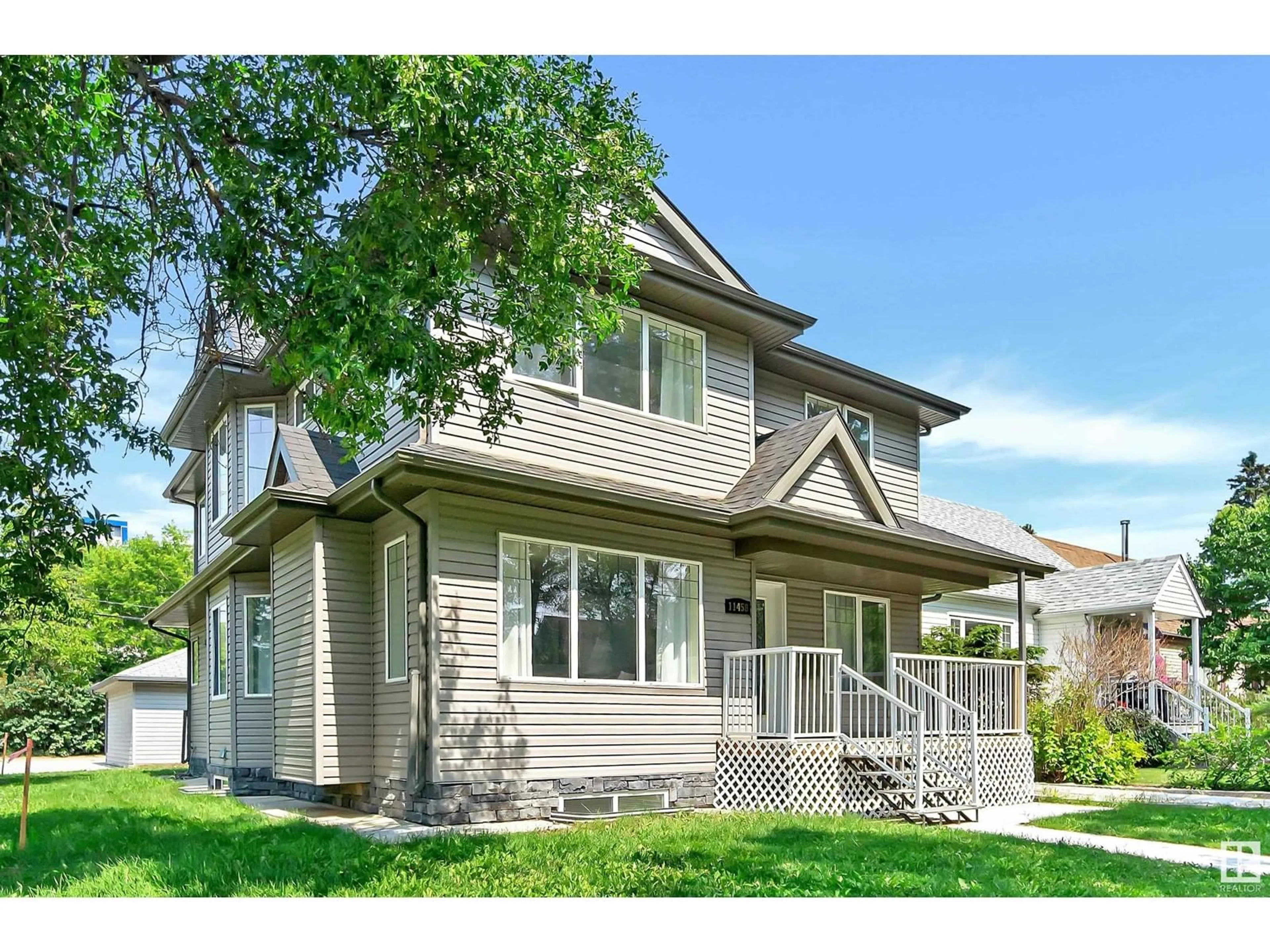 Home with vinyl exterior material, street for 11458 79 AV, Edmonton Alberta T6G0P6