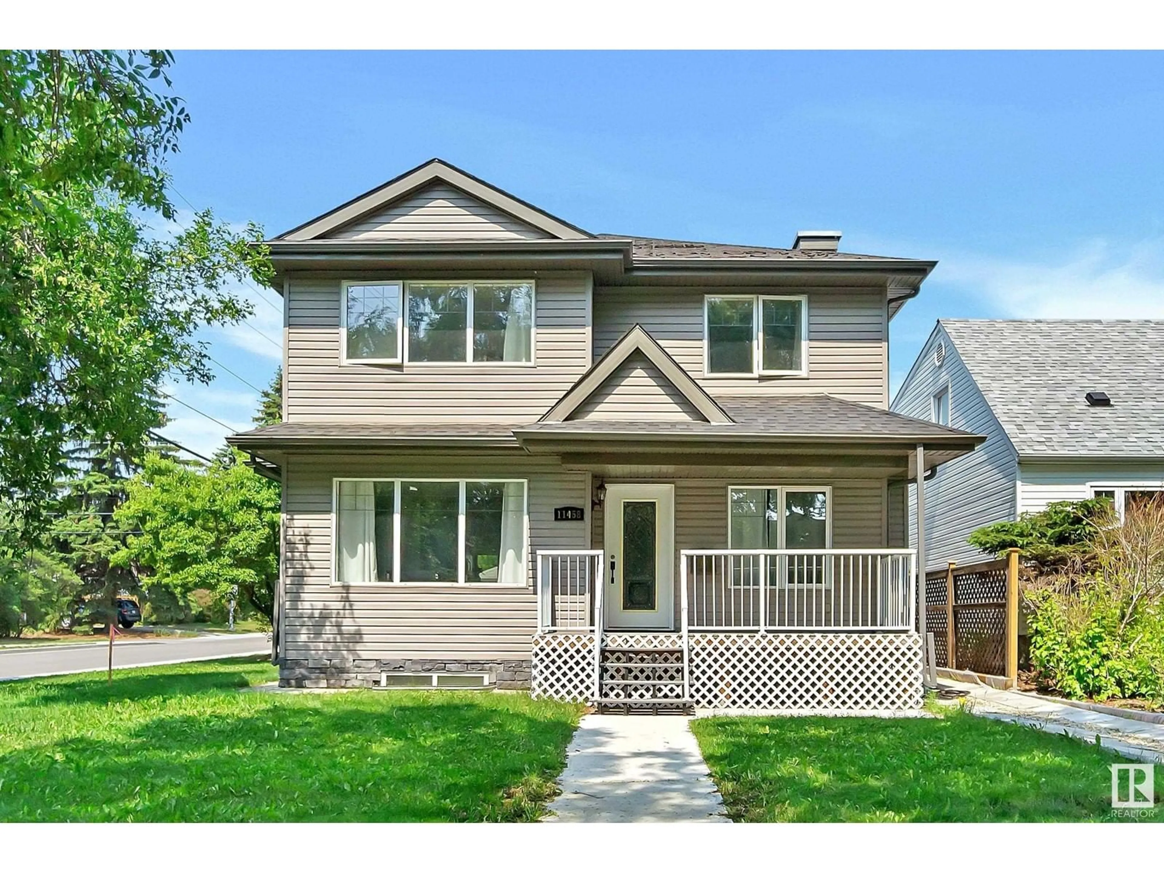 Home with vinyl exterior material, street for 11458 79 AV, Edmonton Alberta T6G0P6
