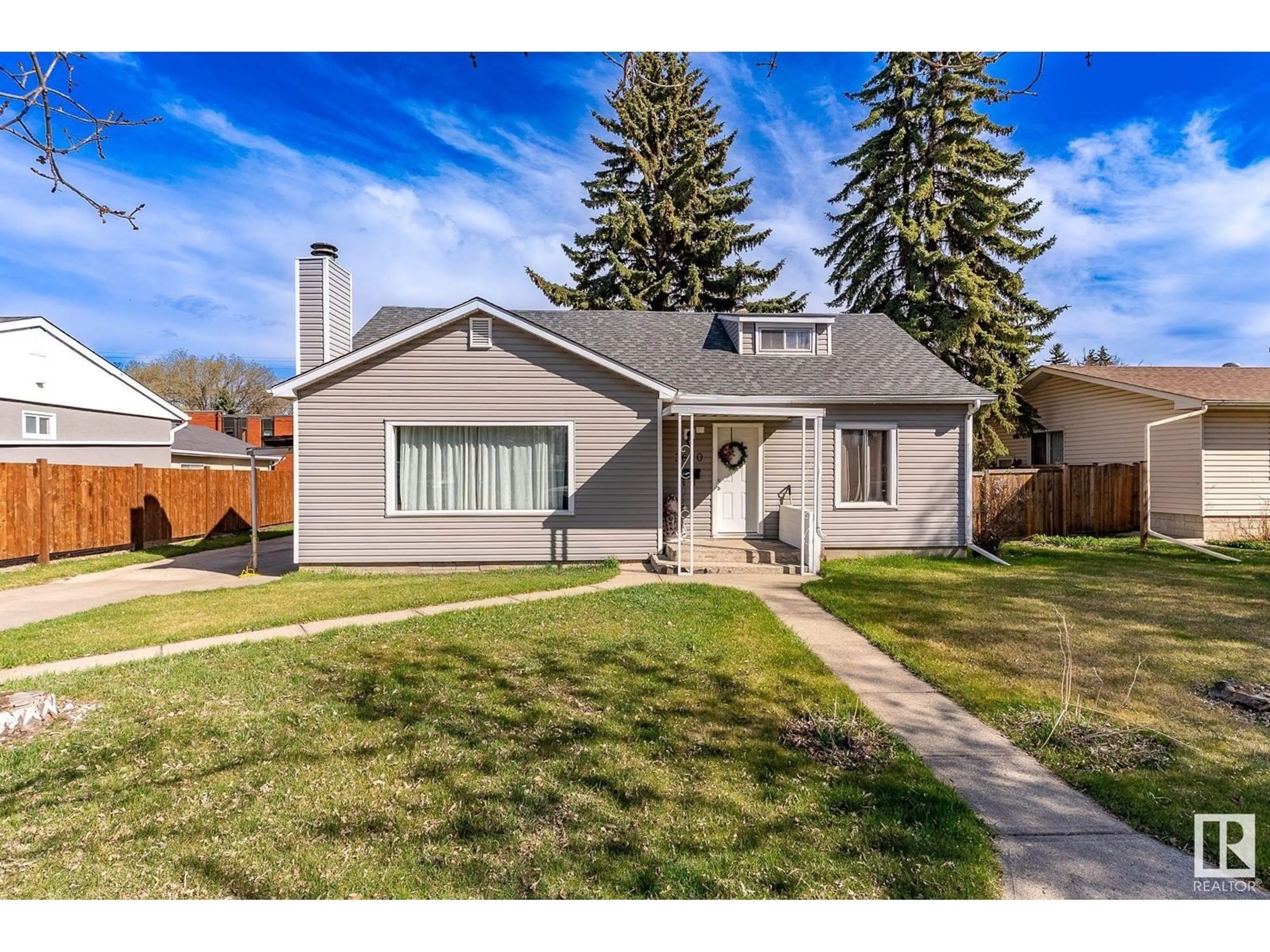 Home with vinyl exterior material, street for 3620 115 AV, Edmonton Alberta T5W0T9