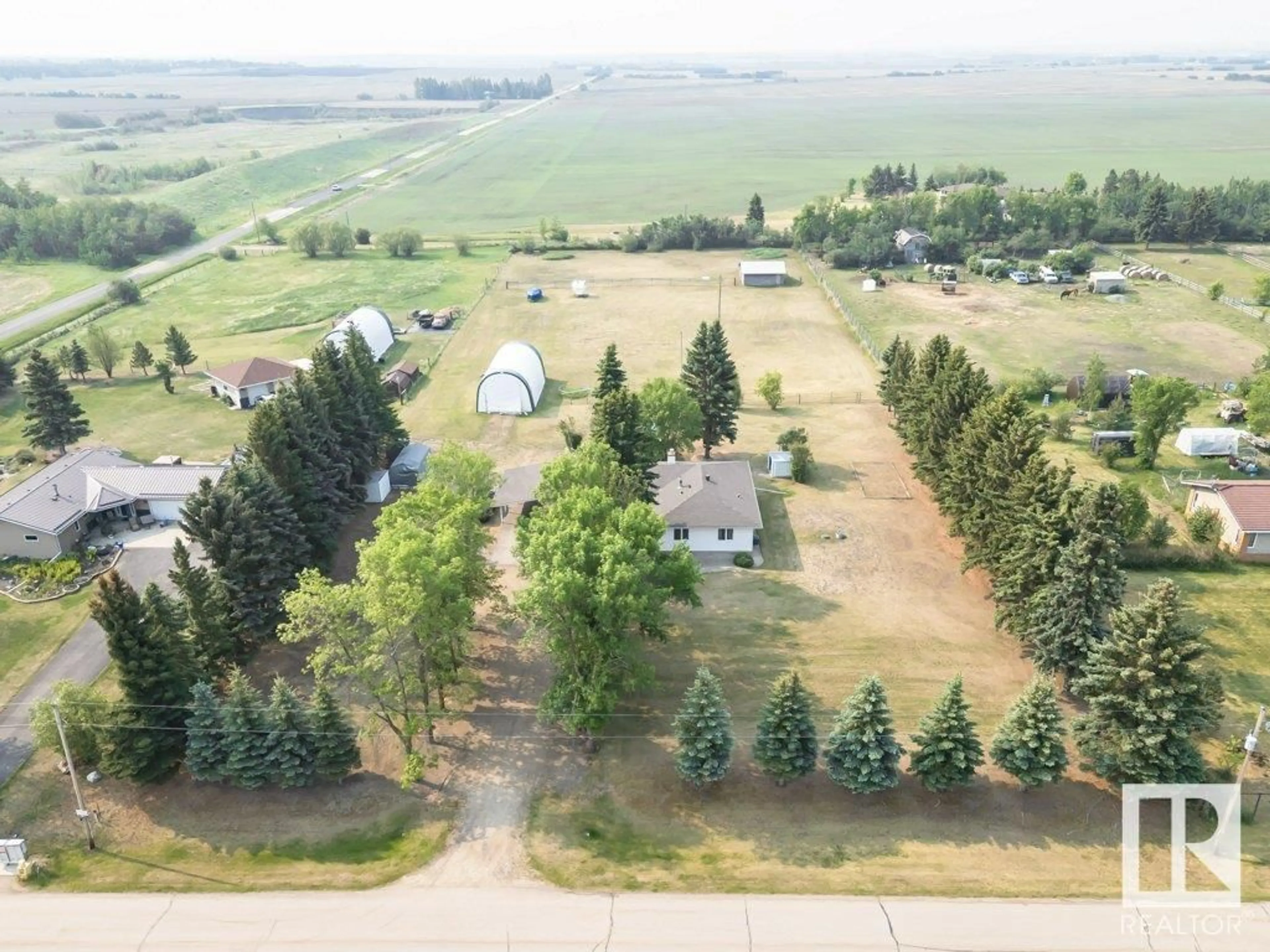 A pic from outside/outdoor area/front of a property/back of a property/a pic from drone, unknown for #15 - 54150 RGE ROAD 224, Rural Strathcona County Alberta T8L3Y5