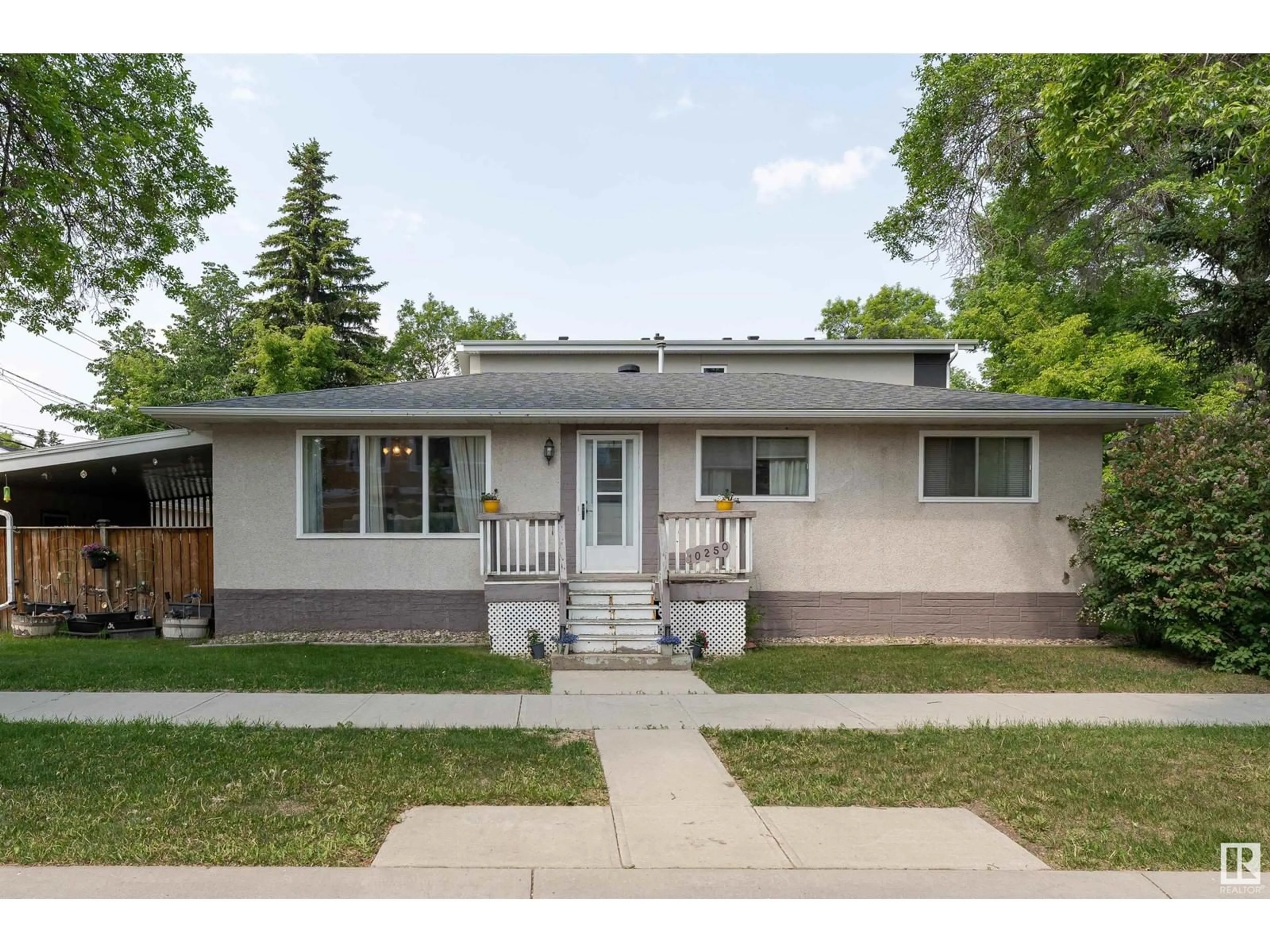 Home with vinyl exterior material, street for 10250 147 ST, Edmonton Alberta T5N3B9