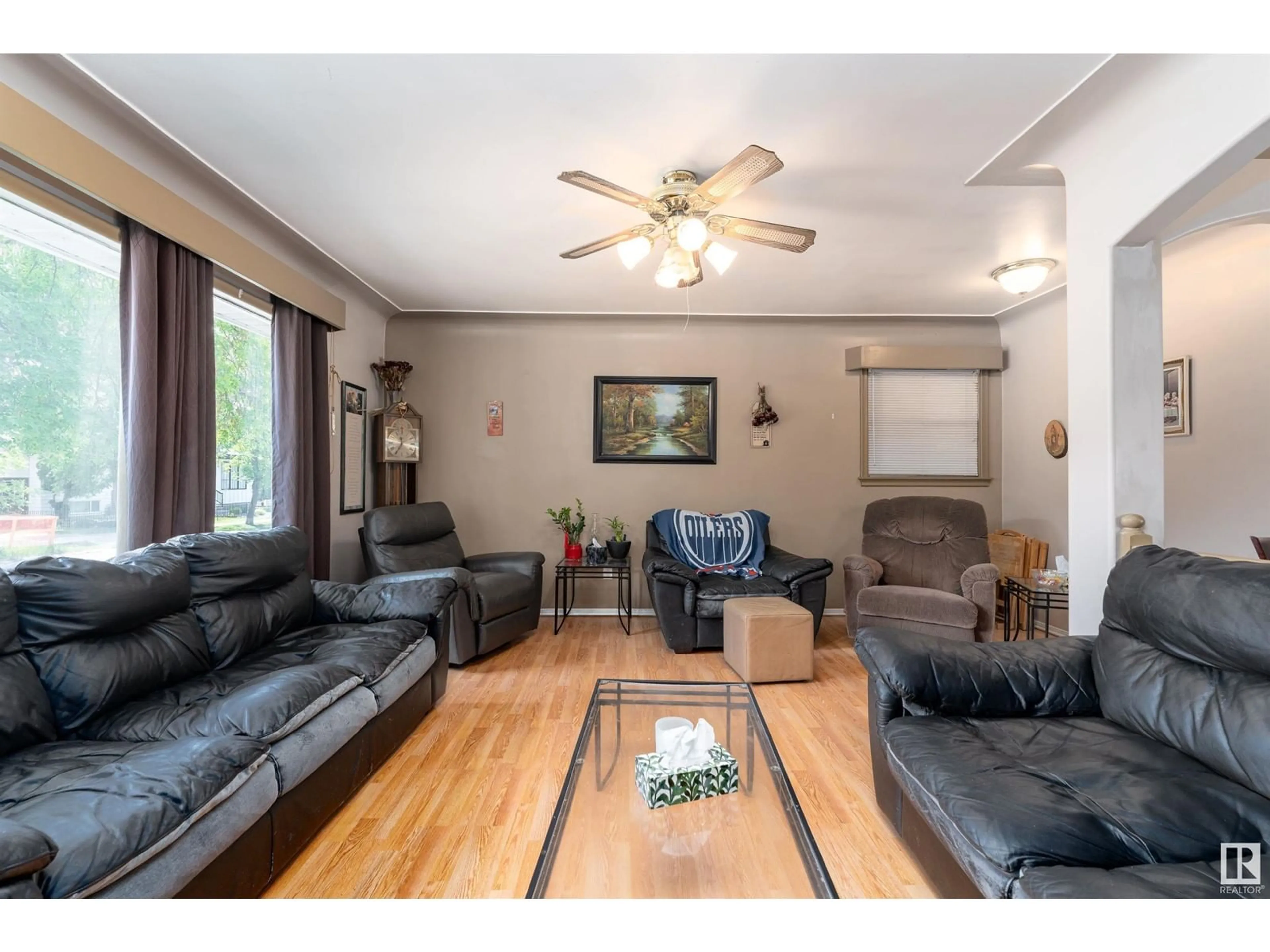 Living room with furniture, wood/laminate floor for 10250 147 ST, Edmonton Alberta T5N3B9