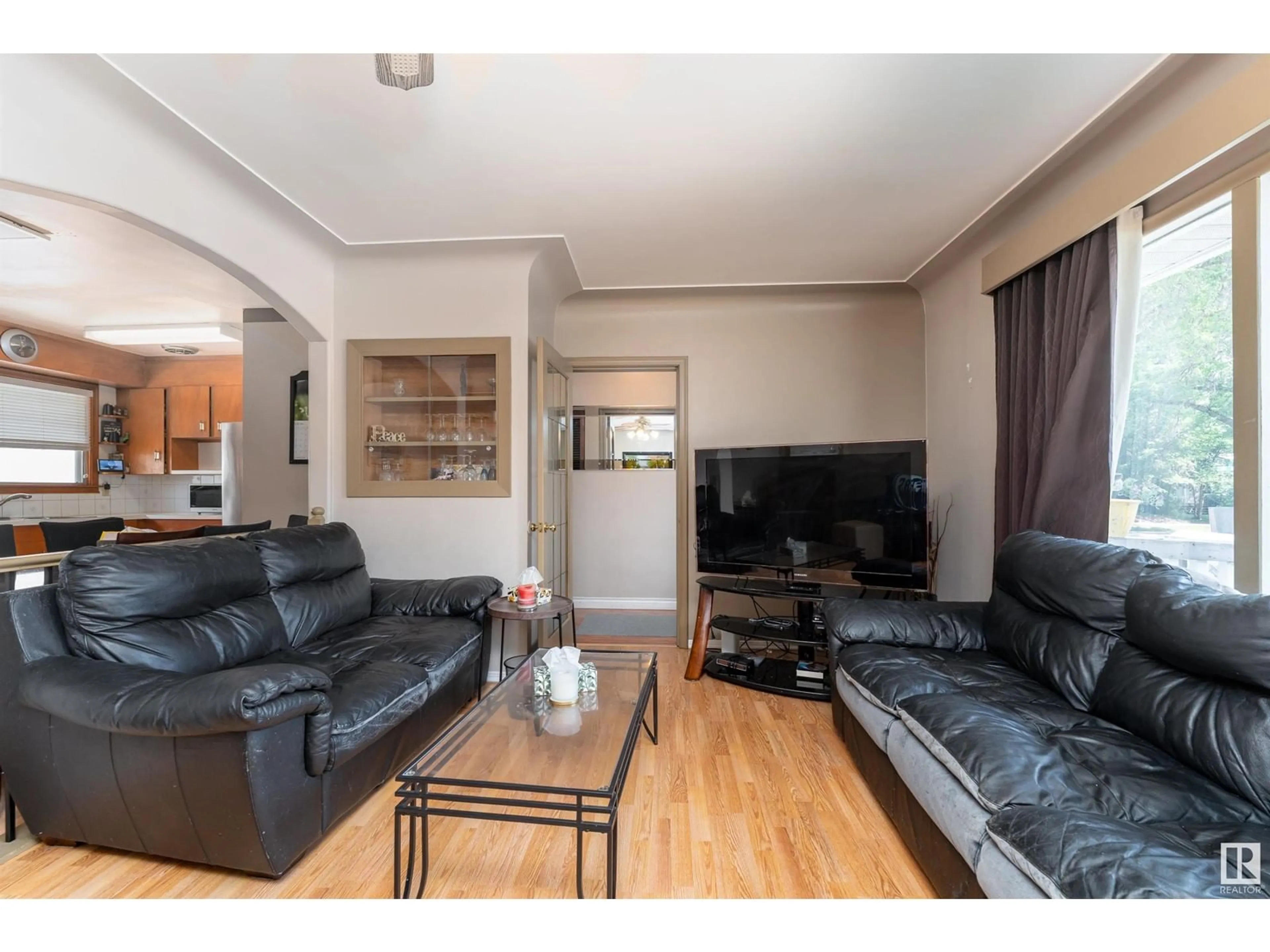 Living room with furniture, wood/laminate floor for 10250 147 ST, Edmonton Alberta T5N3B9