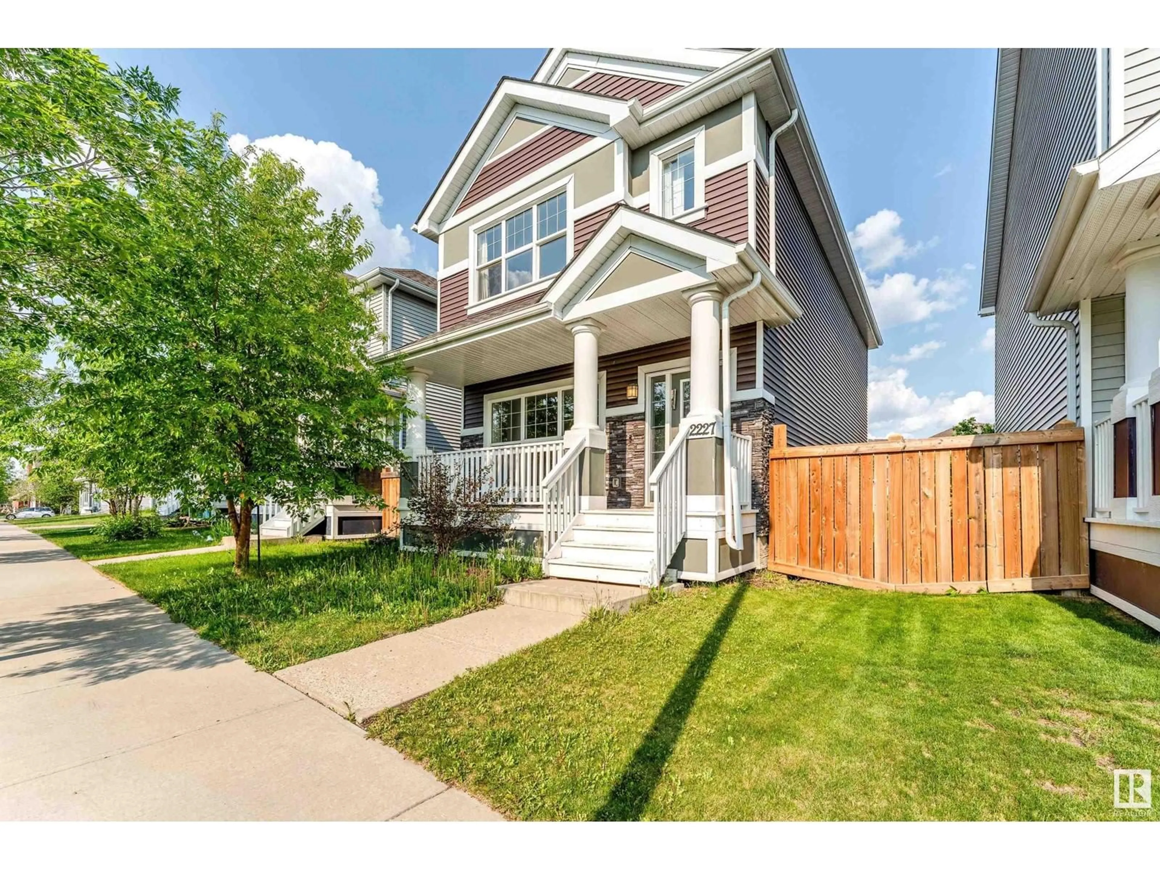 Home with vinyl exterior material, street for 2227 74 ST, Edmonton Alberta T6X0V6