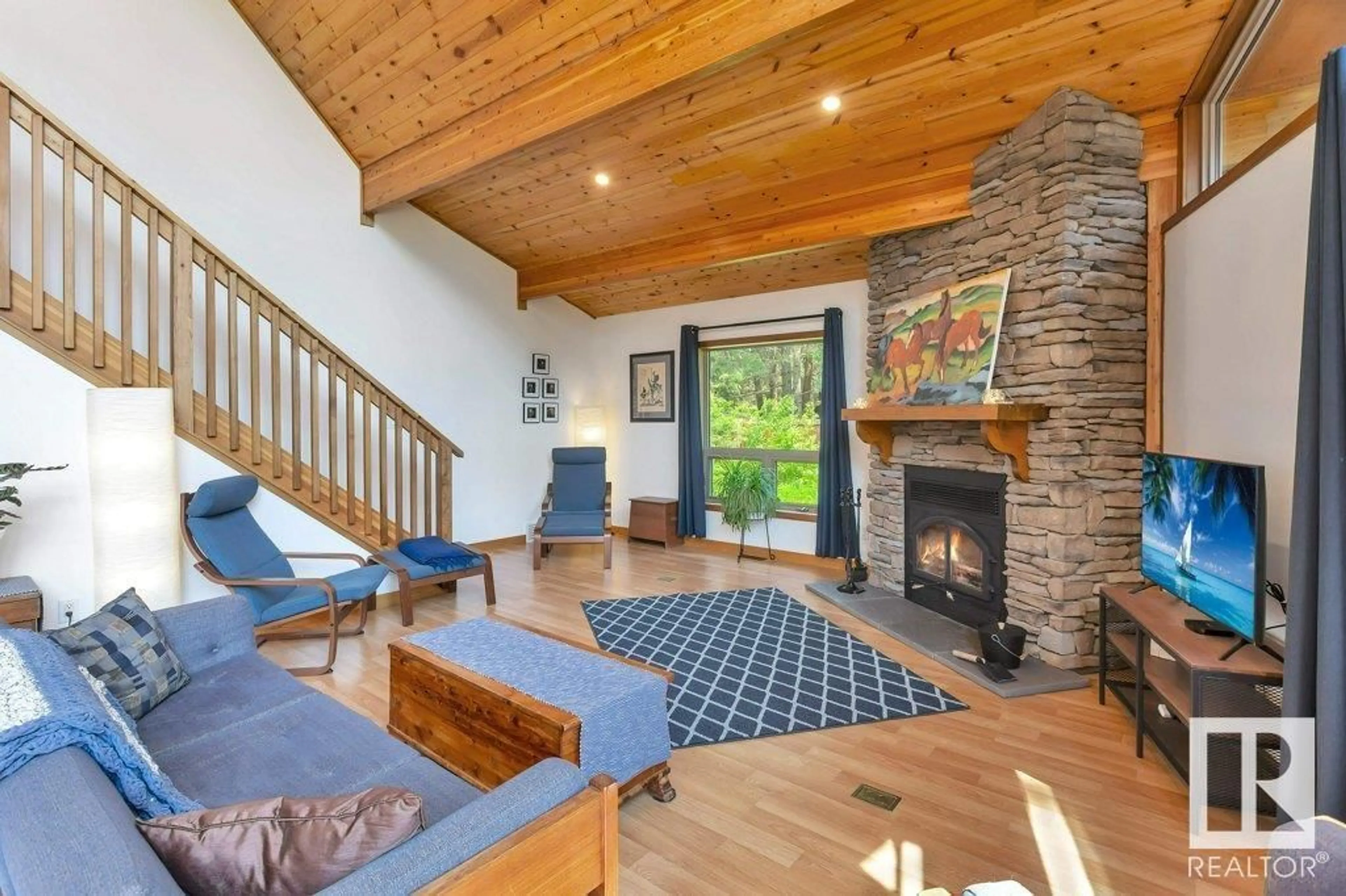 Living room with furniture, wood/laminate floor for 22 62036 TWP ROAD 462, Rural Wetaskiwin County Alberta T0C0C0
