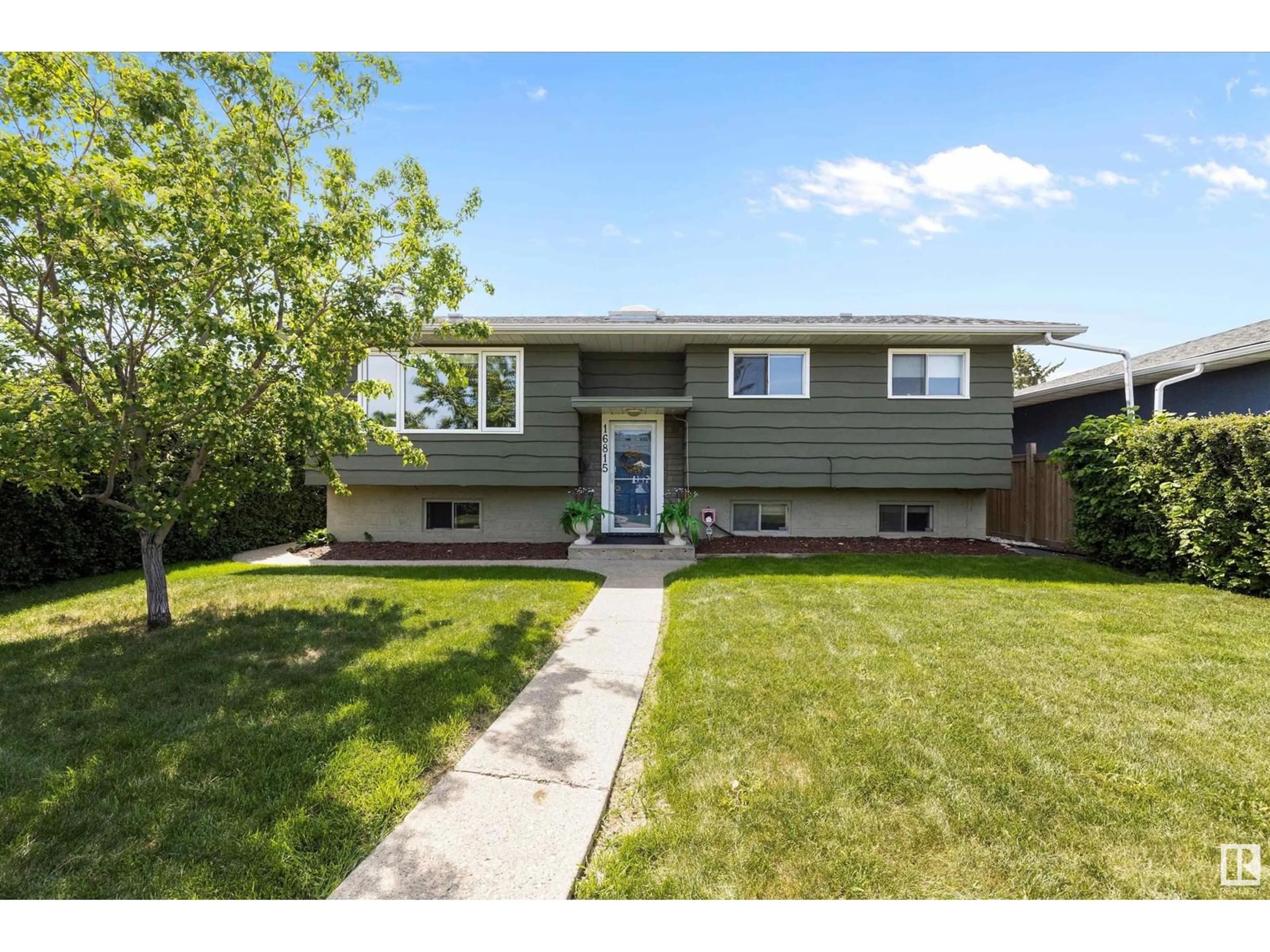 Home with vinyl exterior material, street for 16815 96 AV, Edmonton Alberta T5P0E2