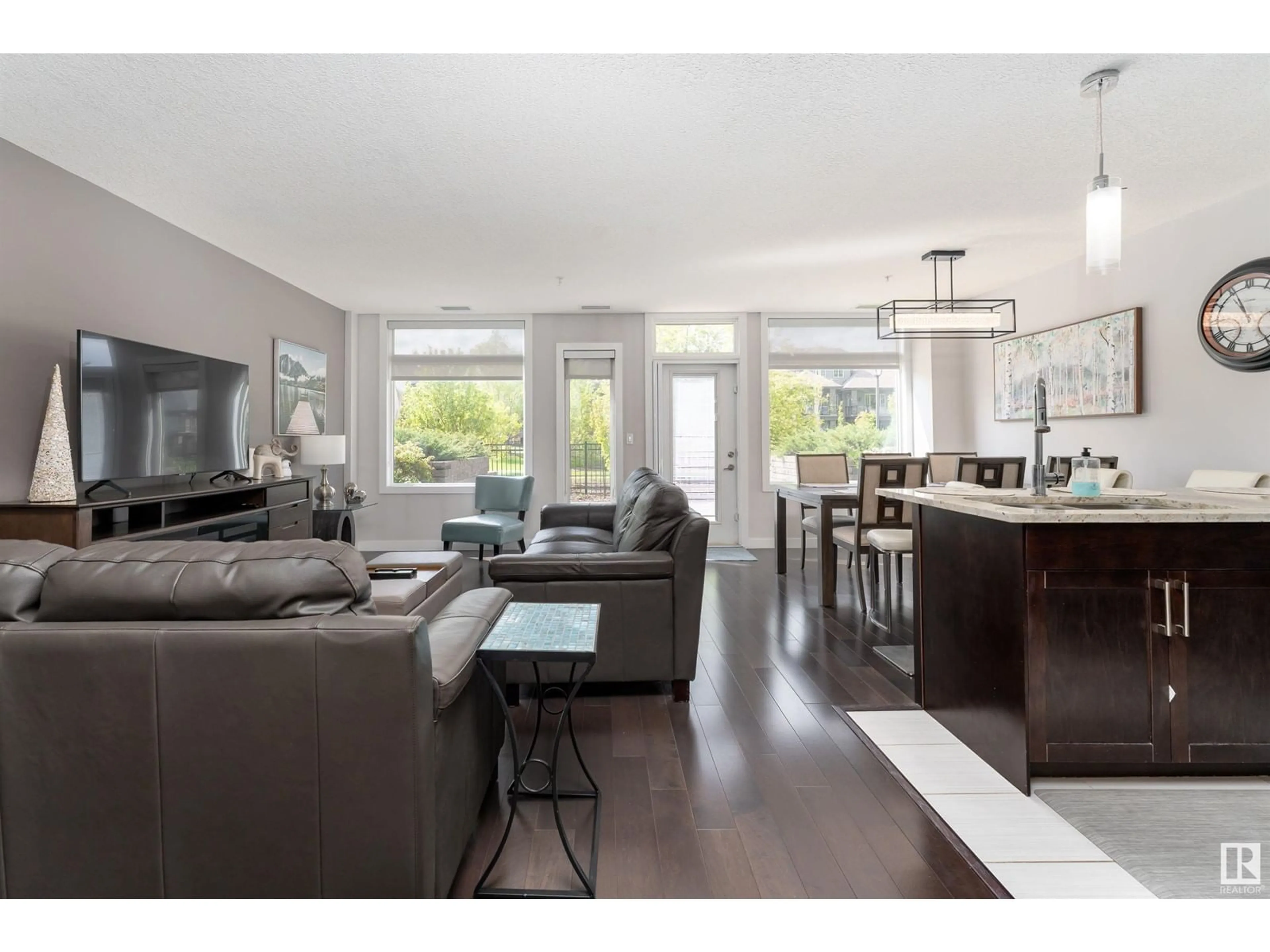 Living room with furniture, wood/laminate floor for #104 - 5151 WINDERMERE BV, Edmonton Alberta T6W2K4