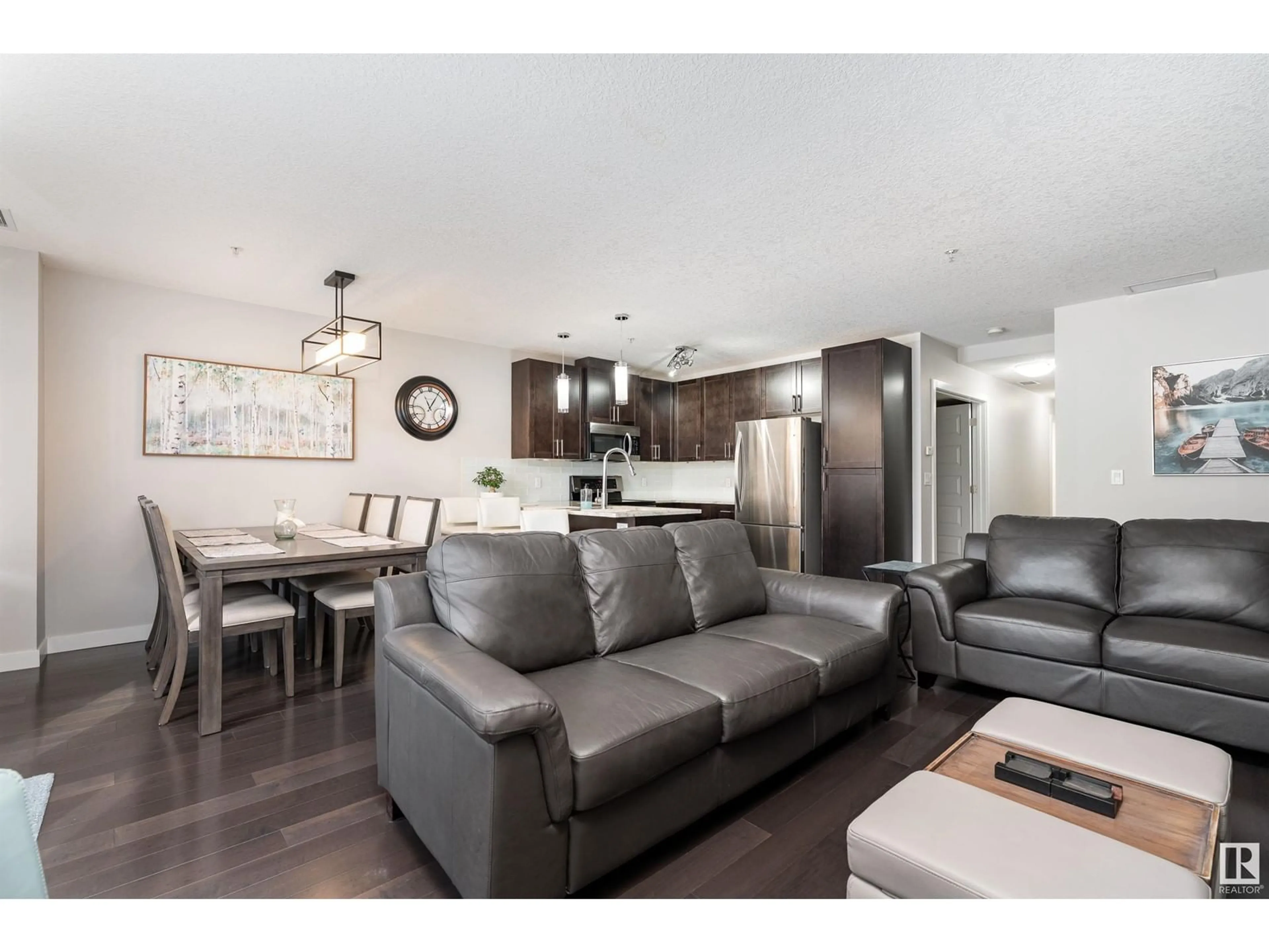 Open concept kitchen, wood/laminate floor for #104 - 5151 WINDERMERE BV, Edmonton Alberta T6W2K4