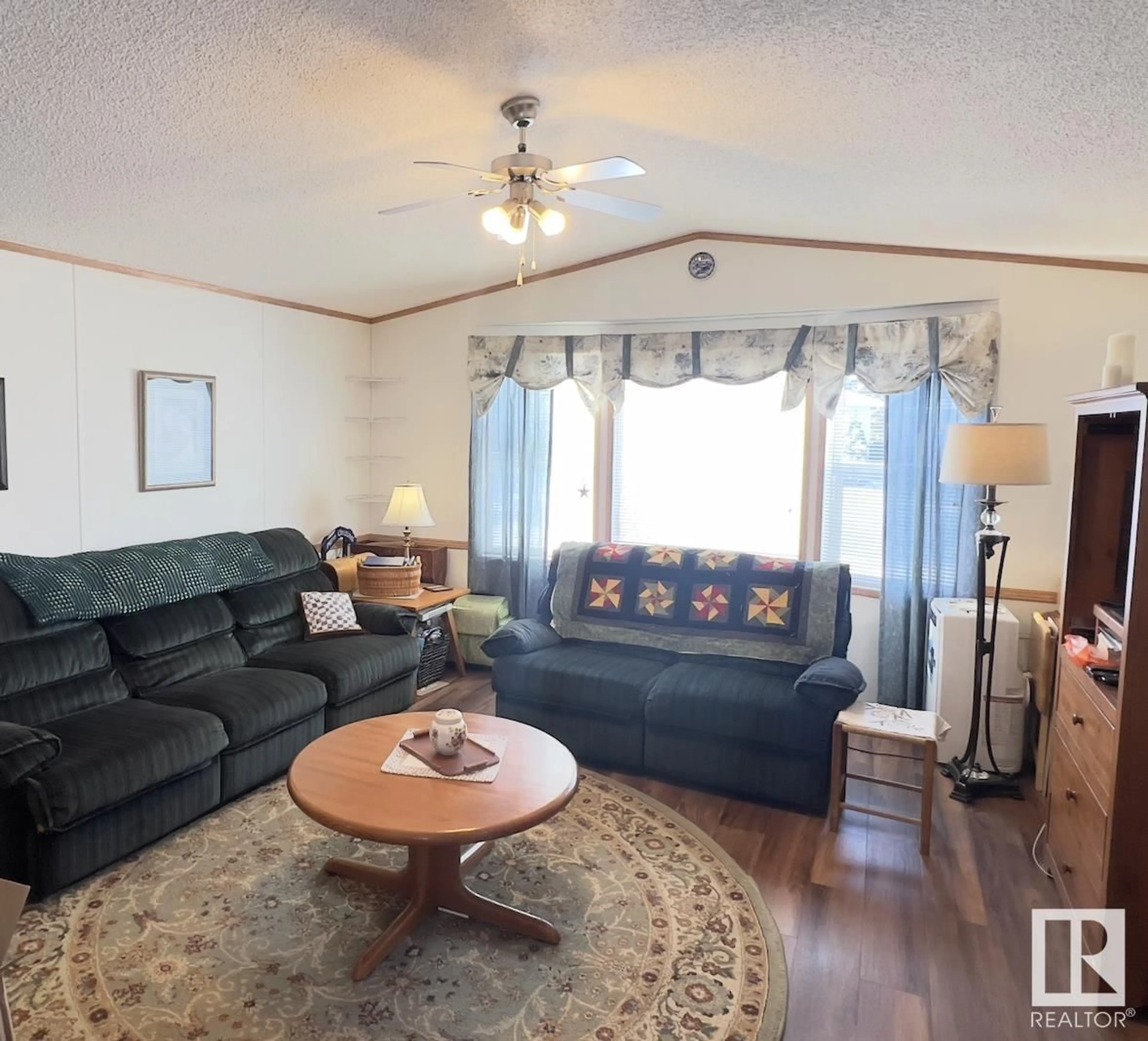 Living room with furniture, wood/laminate floor for 34 WILLOW PARK ESTATES, Leduc Alberta T9E5R1