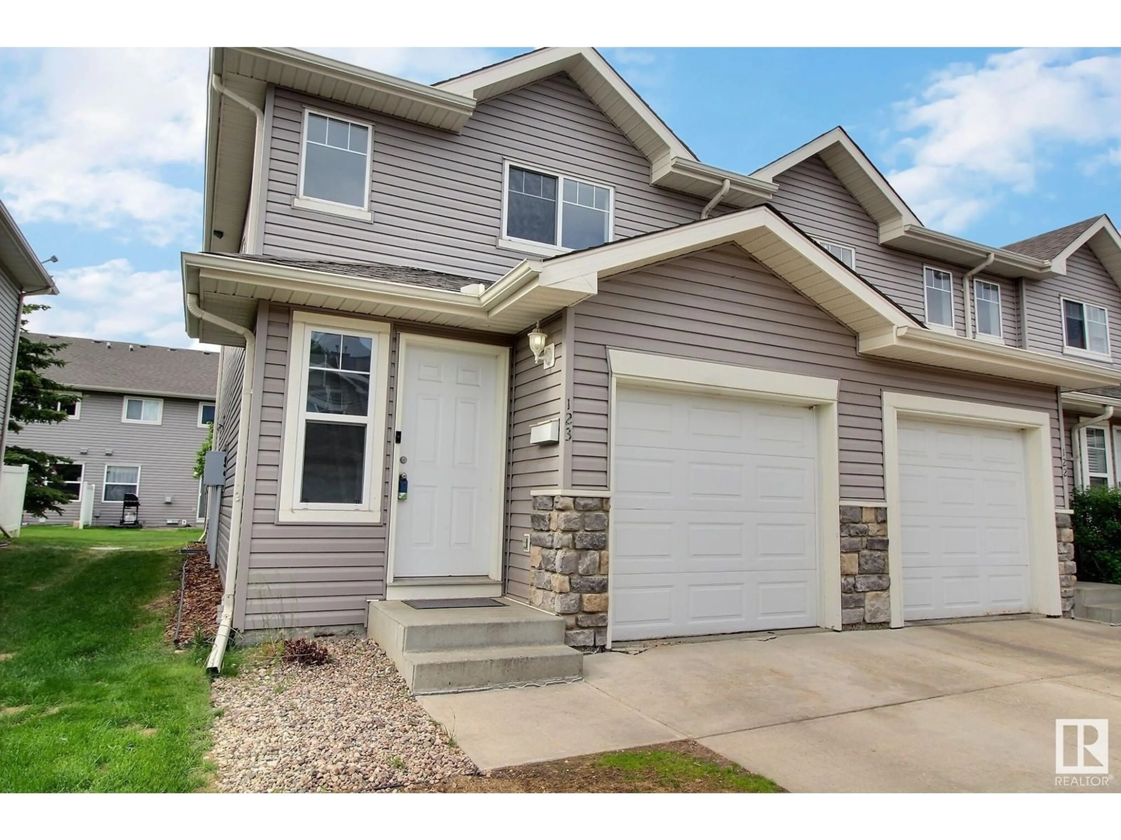 Home with vinyl exterior material, street for 230 EDWARDS DR, Edmonton Alberta T6X1G7