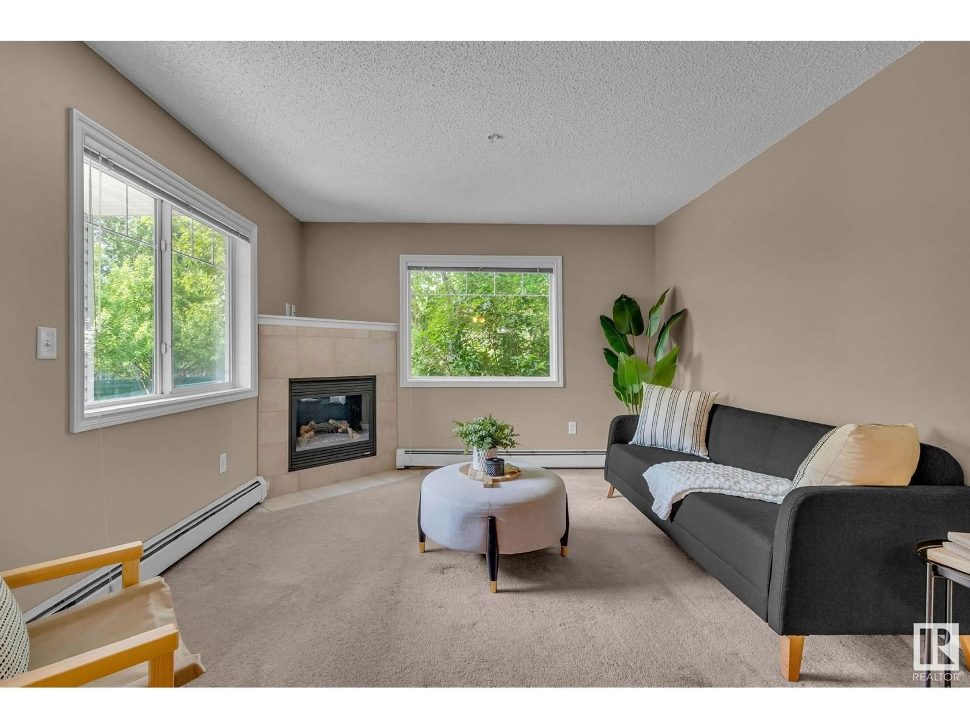 Living room with furniture, unknown for #114 - 905 BLACKLOCK WY, Edmonton Alberta T6W1M7