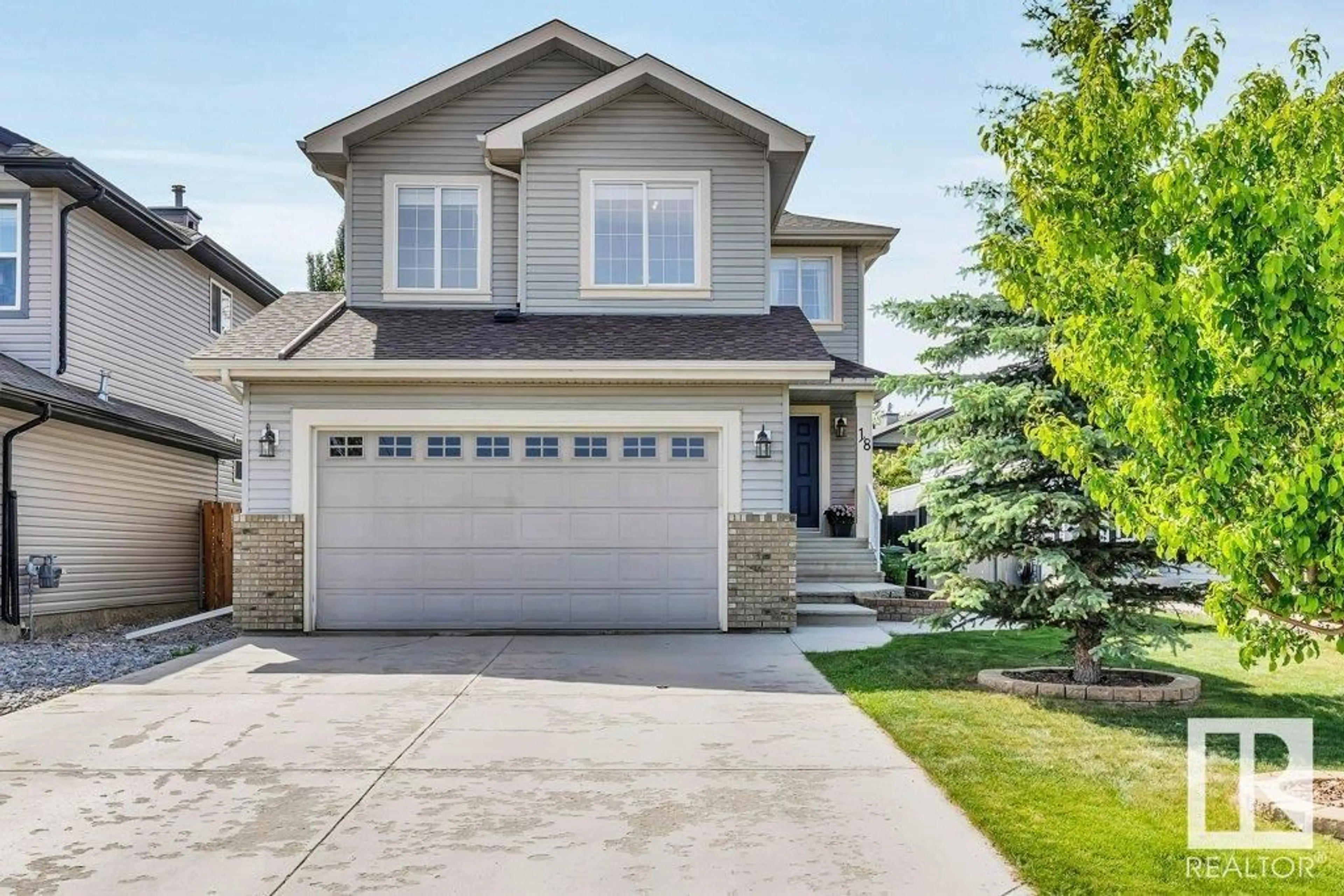 Home with vinyl exterior material, street for 18 SNOWDROP CO, Leduc Alberta T9E0H5