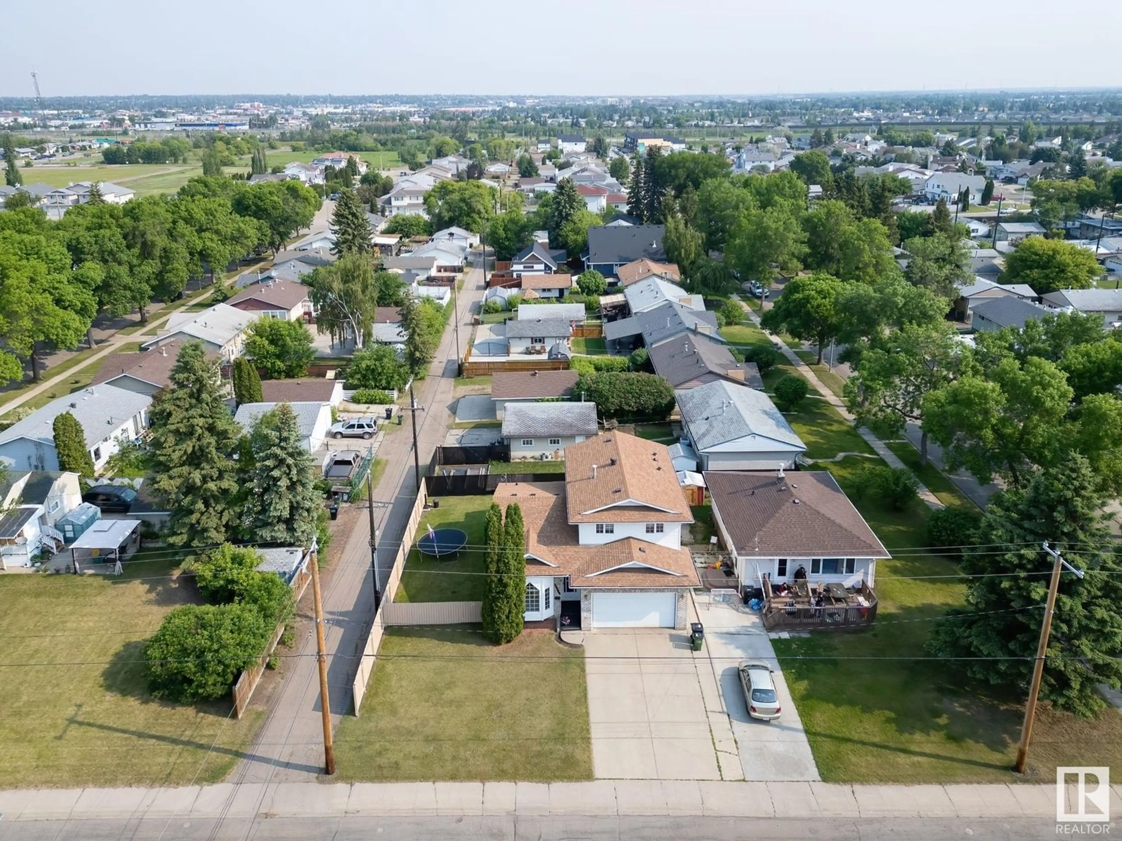 A pic from outside/outdoor area/front of a property/back of a property/a pic from drone, street for 4708 122 AV, Edmonton Alberta T5W5H4