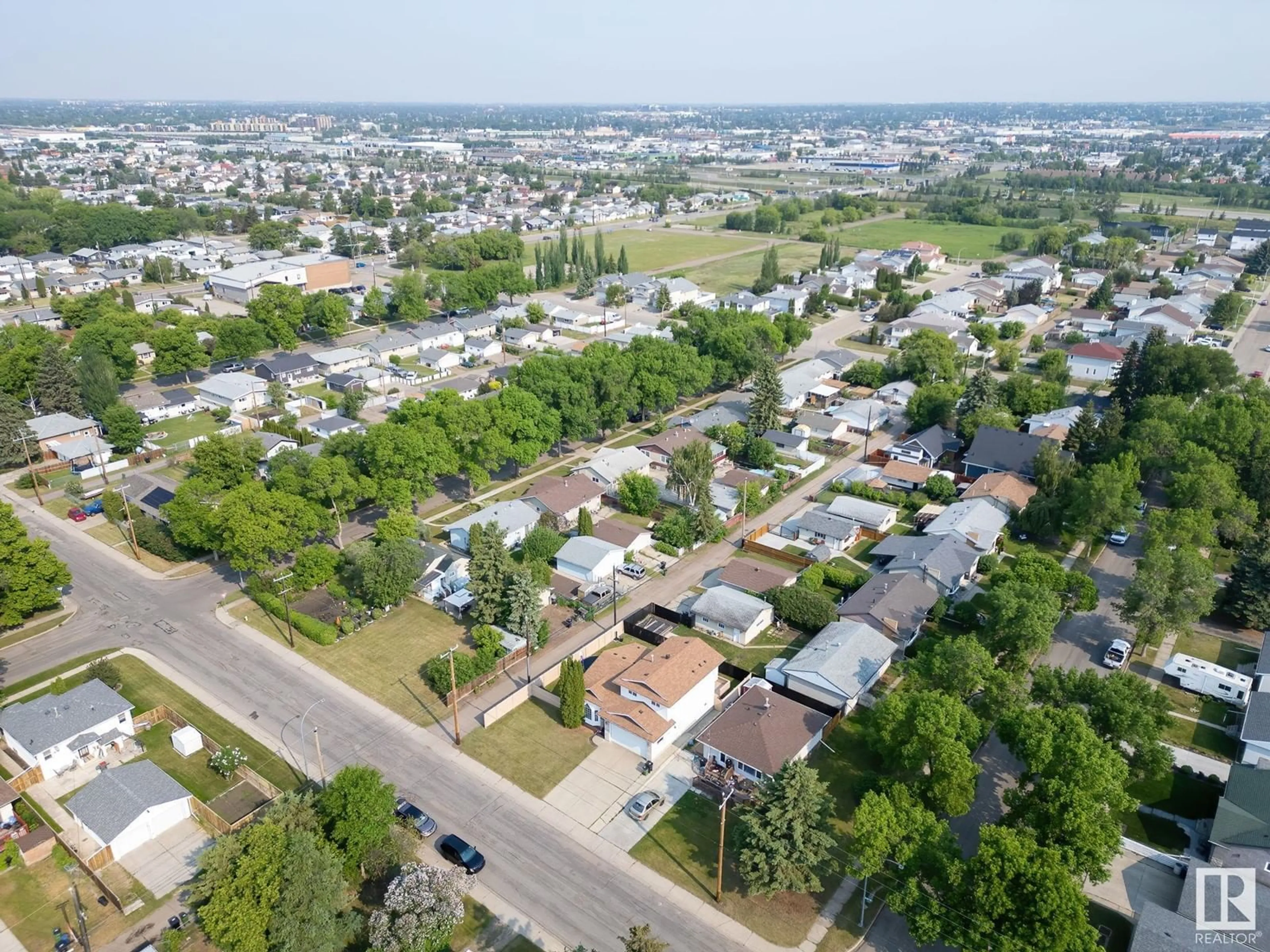 A pic from outside/outdoor area/front of a property/back of a property/a pic from drone, street for 4708 122 AV, Edmonton Alberta T5W5H4