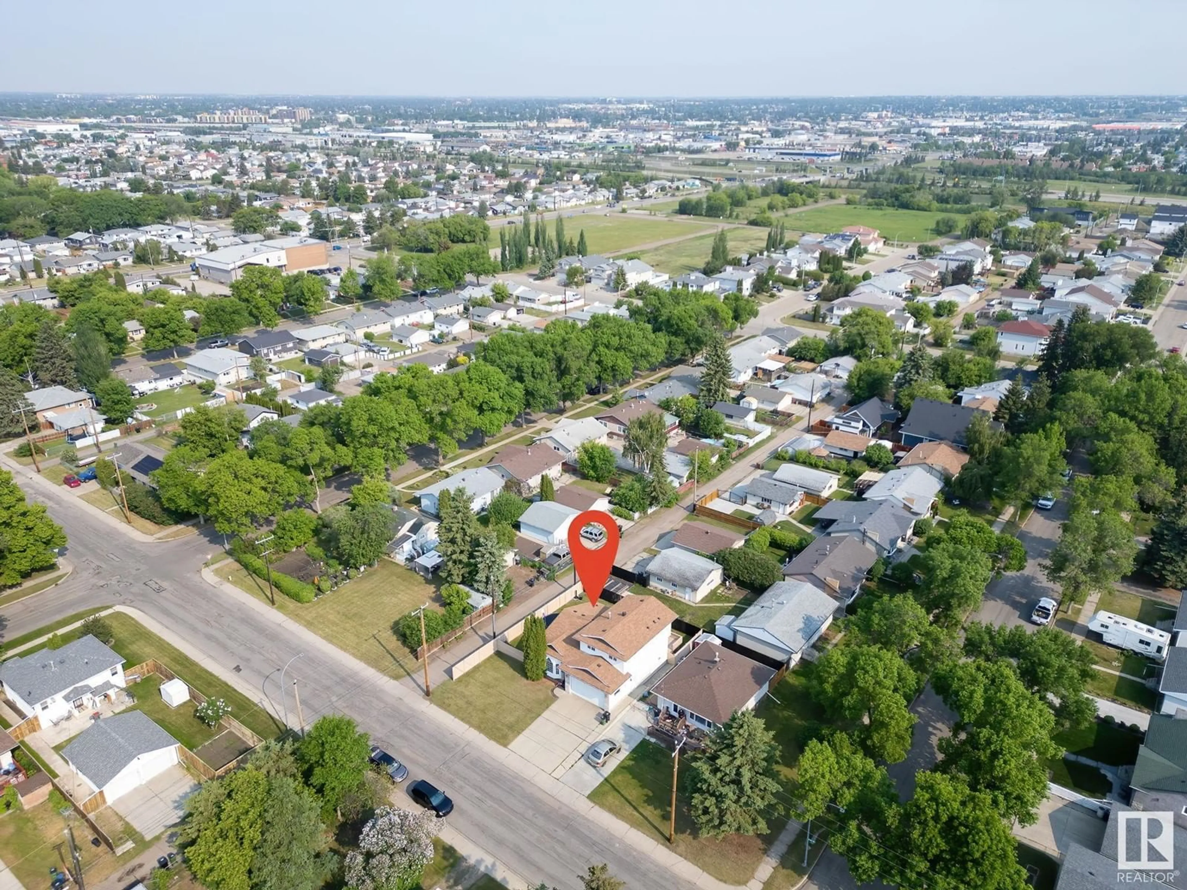 A pic from outside/outdoor area/front of a property/back of a property/a pic from drone, street for 4708 122 AV, Edmonton Alberta T5W5H4