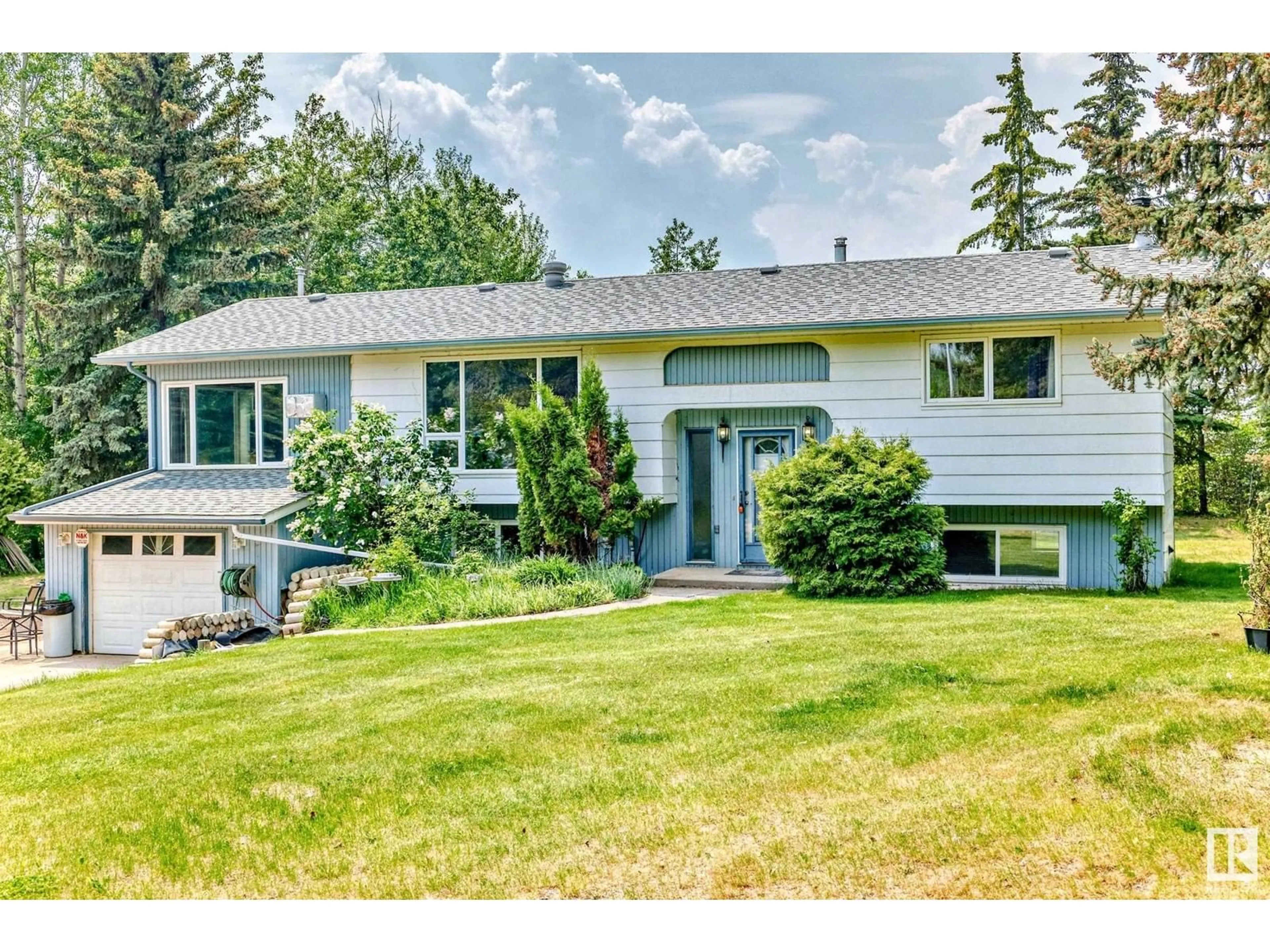 Home with vinyl exterior material, street for 4701 22 ST, Rural Wetaskiwin County Alberta T0C2C0