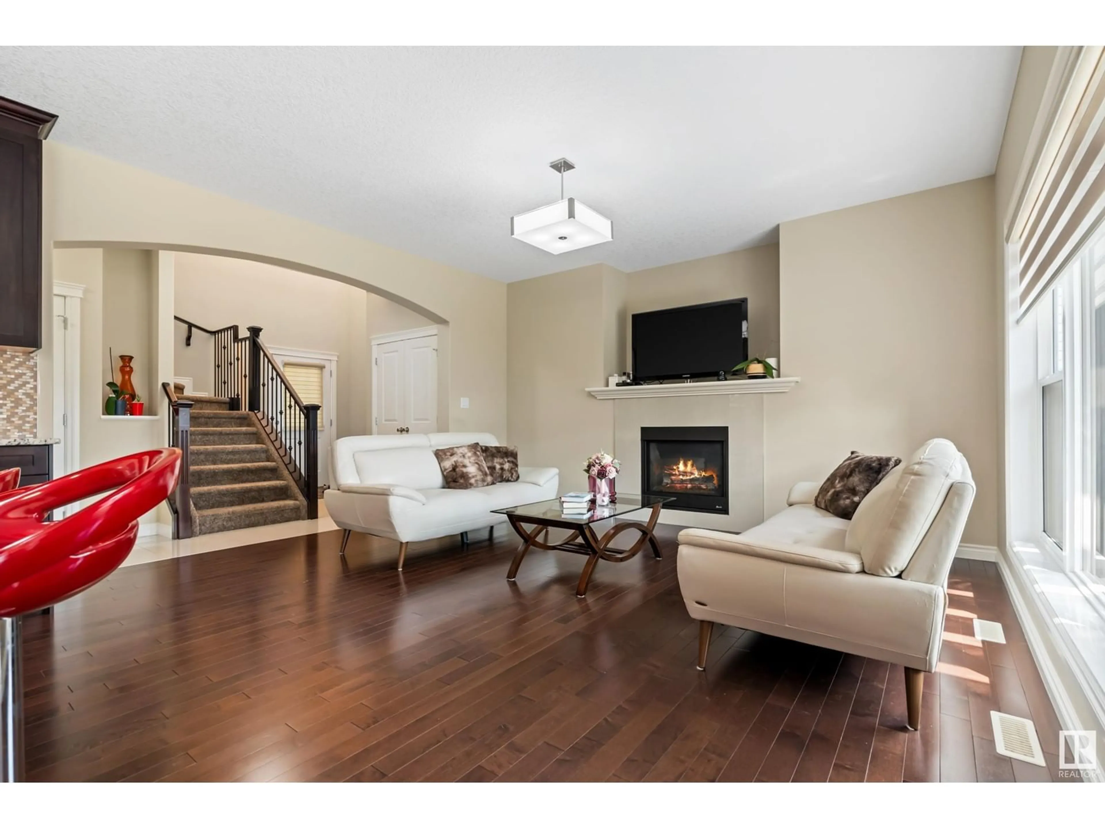 Living room with furniture, wood/laminate floor for 22513 94A AV, Edmonton Alberta T5T7B2