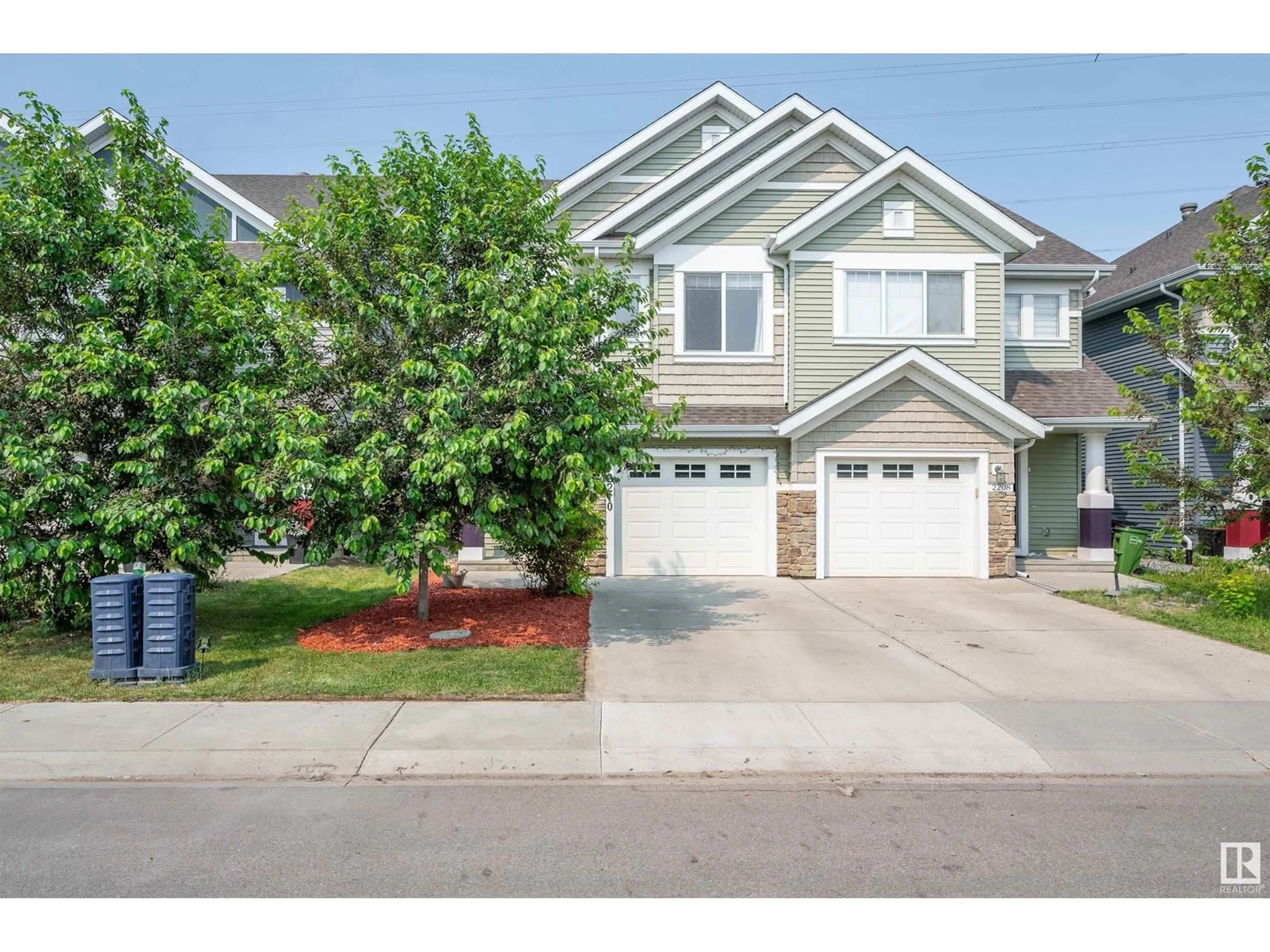 Home with vinyl exterior material, street for 2210 86 ST, Edmonton Alberta T6X2G2