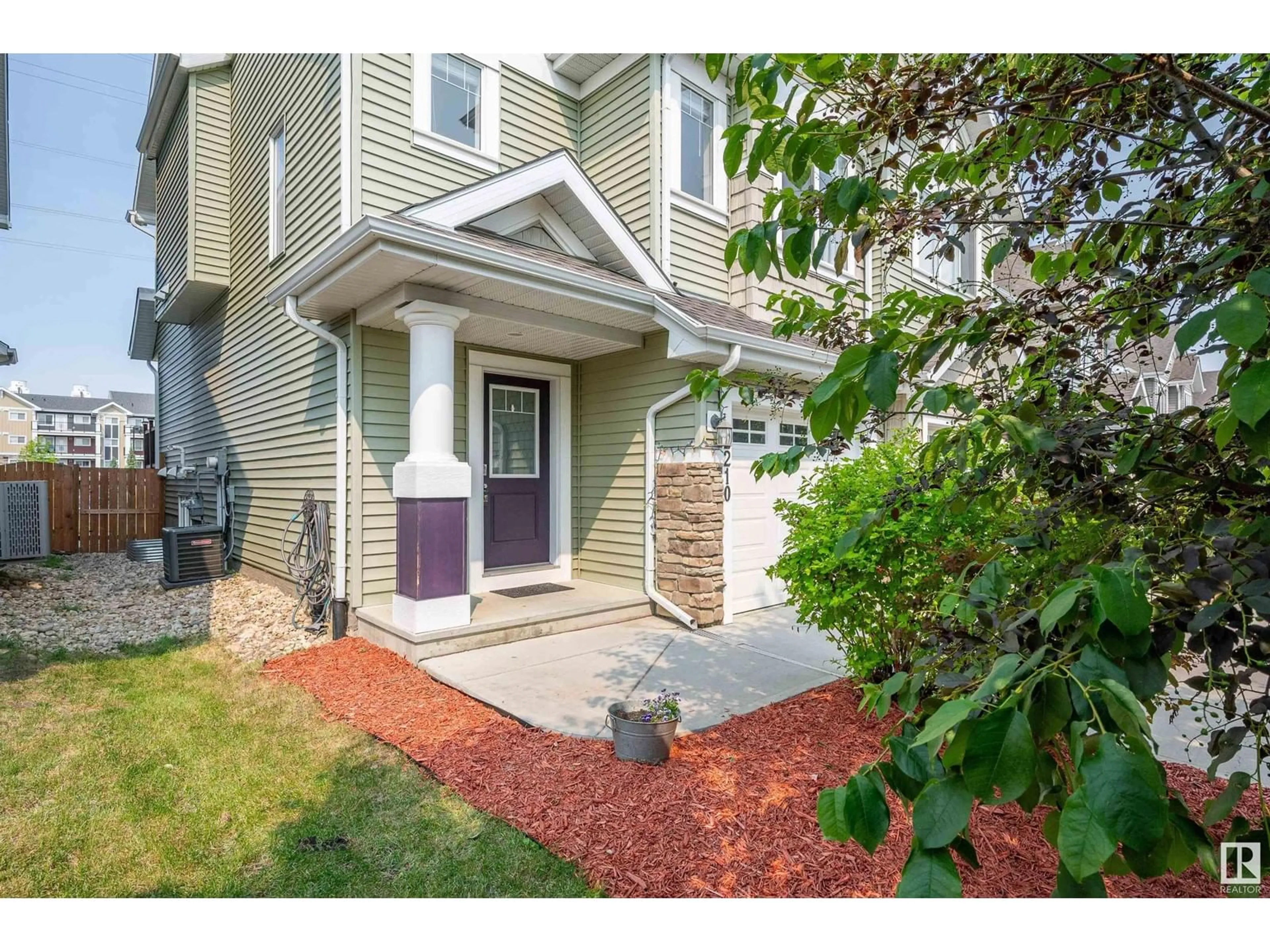 Home with vinyl exterior material, street for 2210 86 ST, Edmonton Alberta T6X2G2