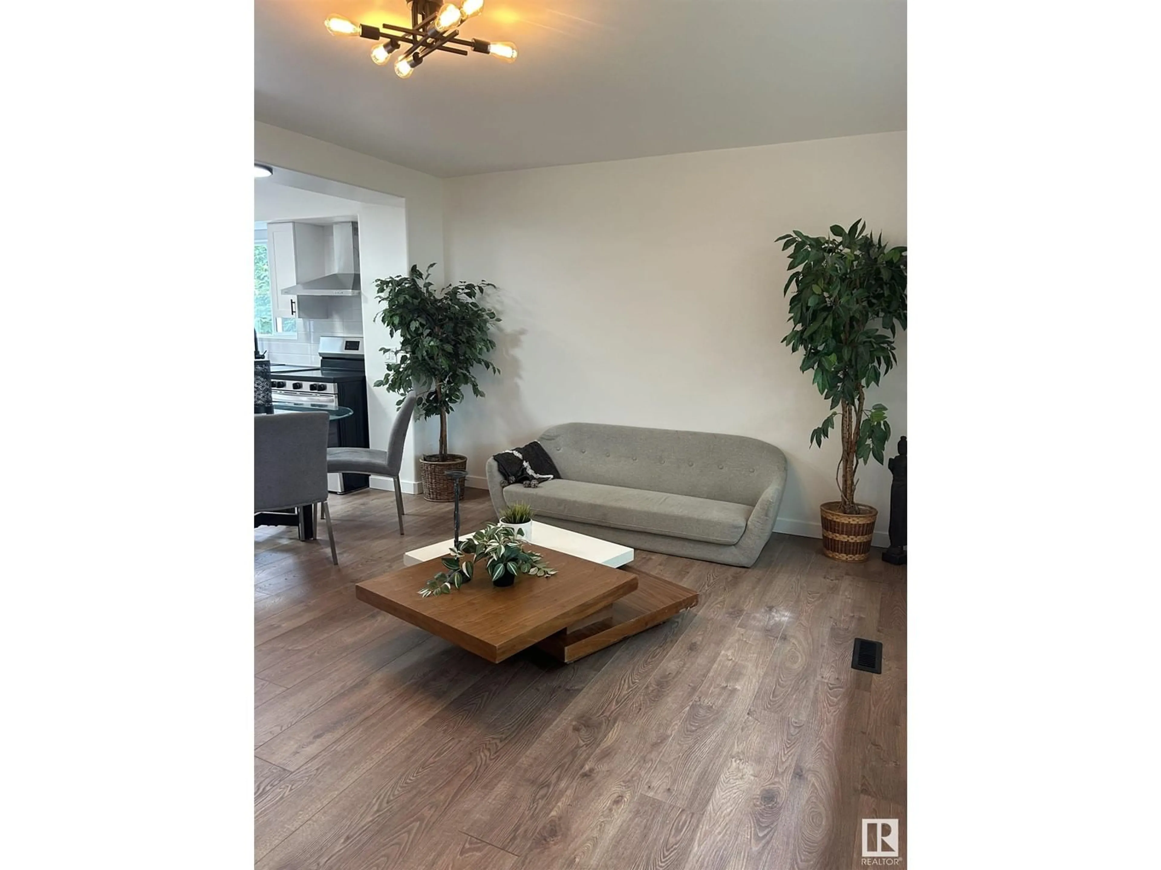 Living room with furniture, wood/laminate floor for NW - 12013 40 ST, Edmonton Alberta T5W2L2