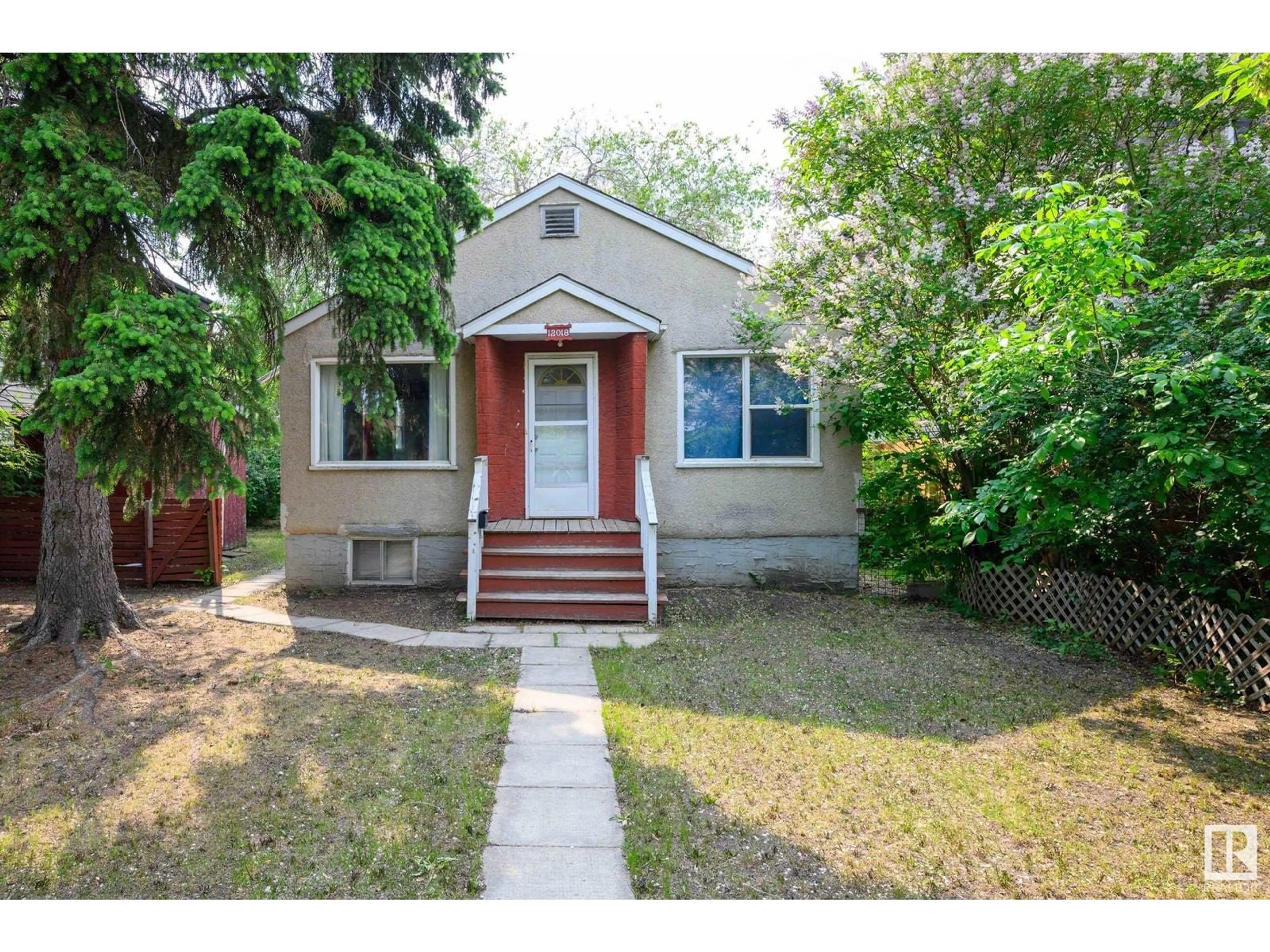 Home with vinyl exterior material, street for NW - 12018 122 ST, Edmonton Alberta T5L0C6