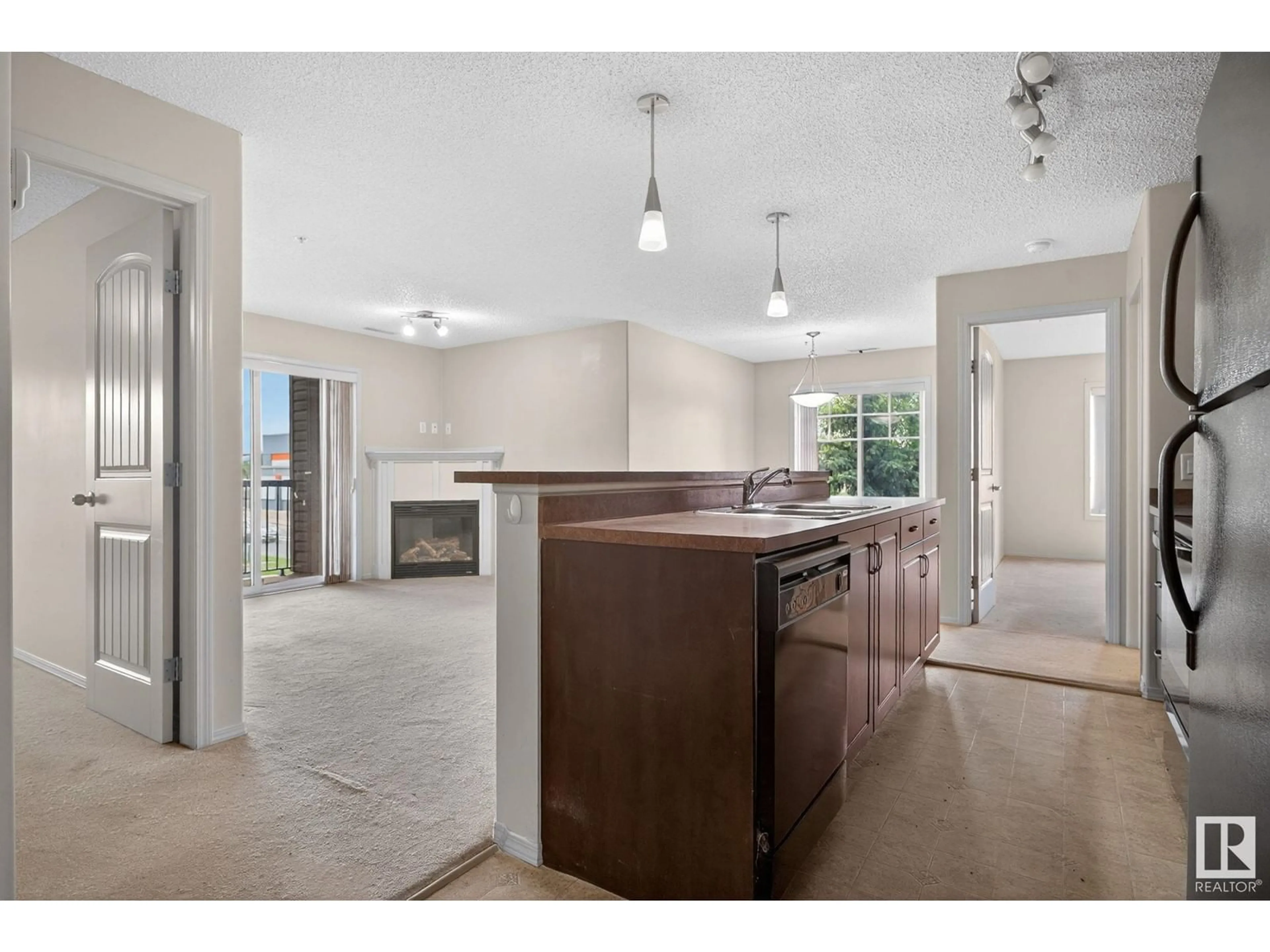 Open concept kitchen, ceramic/tile floor for #212 - 17415 99 AV, Edmonton Alberta T5T0W8